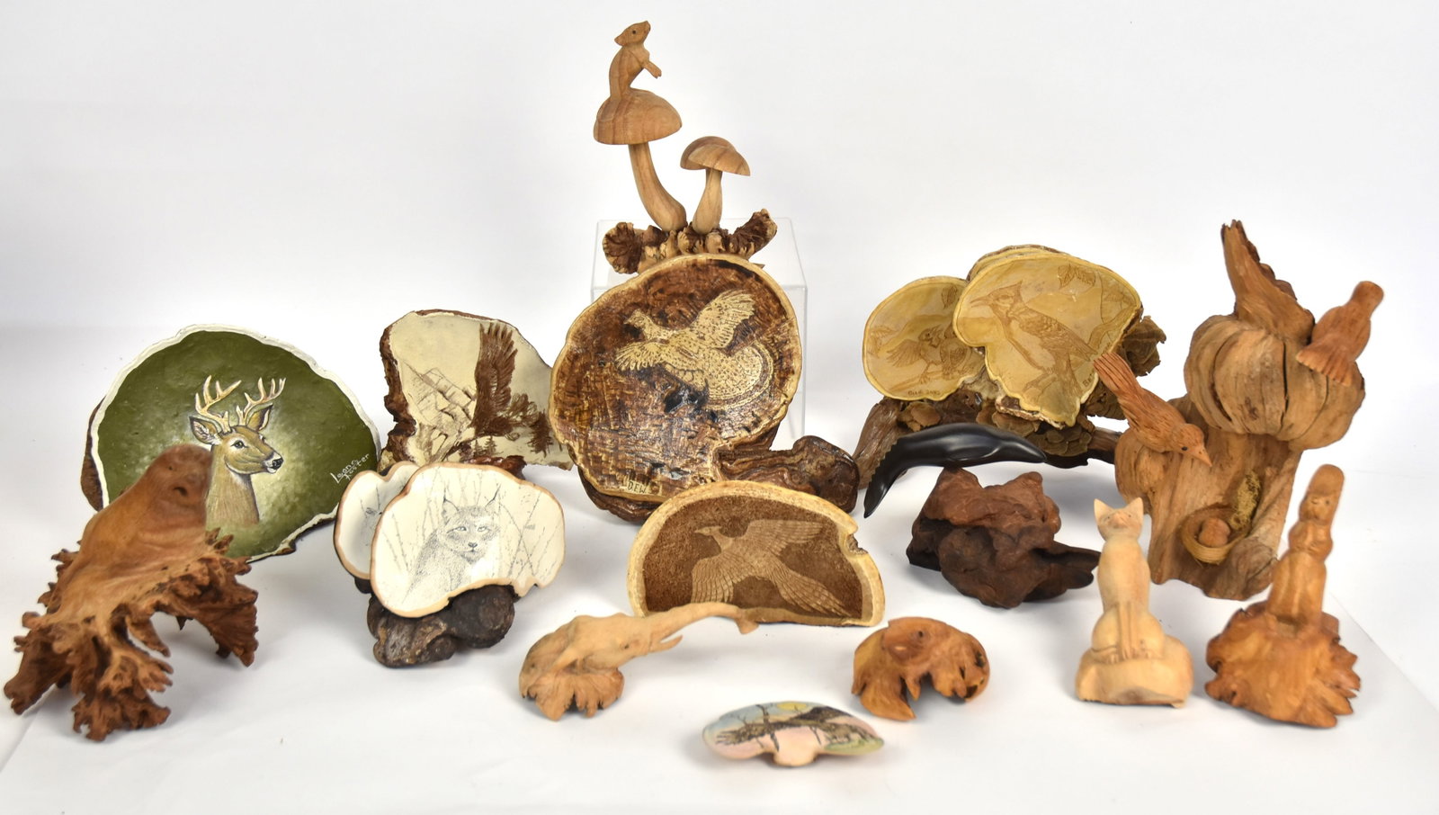 Root & Bracket Fungus Art: Lot of 15, including eght hardwood root carving, subjects include, porpoise, birds, cat, elephant, mouse and squirrle, largest is 10" high; and seven scrimshaw of painted bracket fungus, four artist s