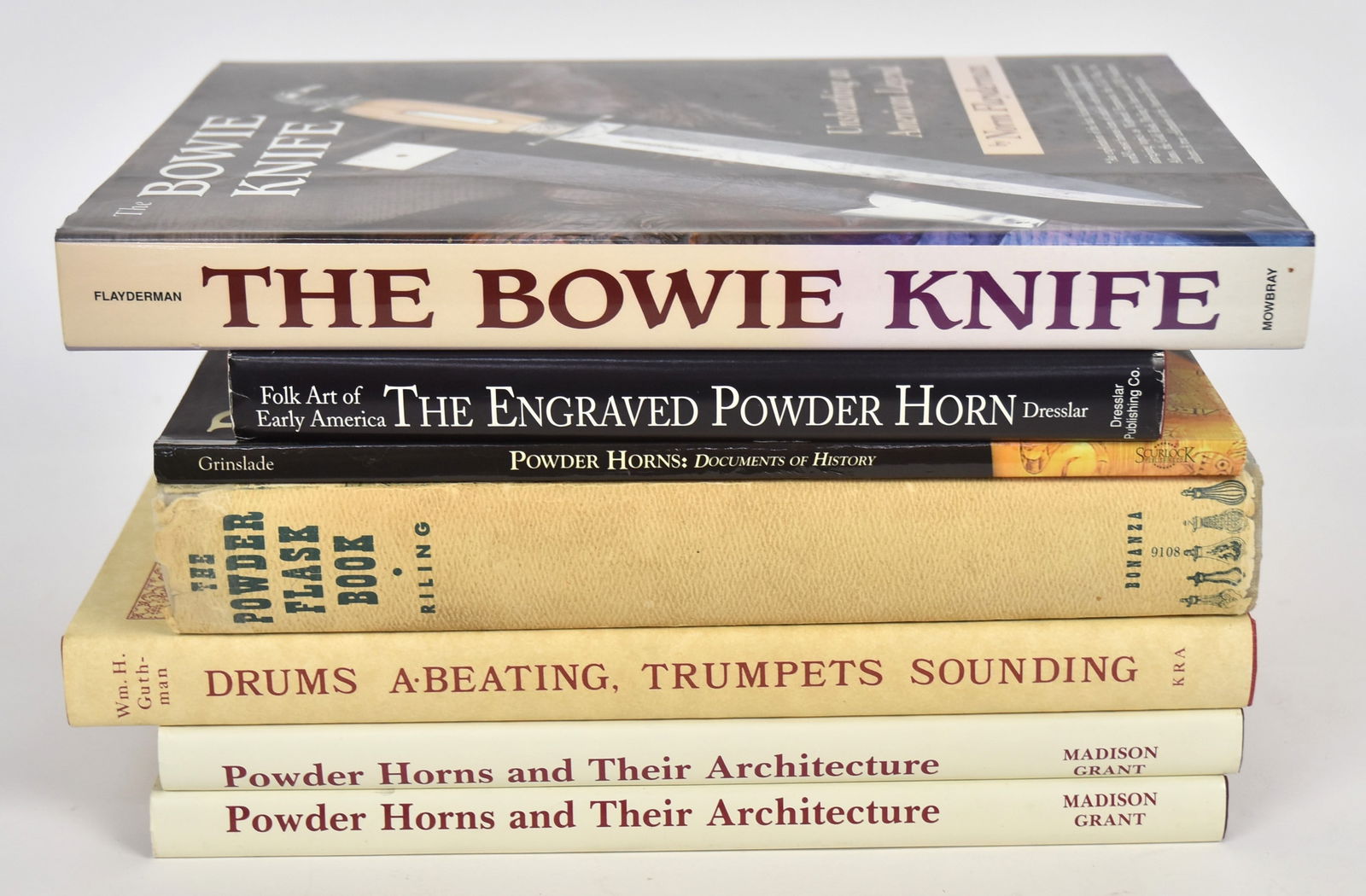 Books on Bowie Knives, Powder Horns & Flasks: Lot of seven including the following titles: The Bowie Knife: Unsheathing an American Legend, by Norm Flayderman, with inked presentation inscription on front end papr by Norm Fladerman, 2004; plus Th