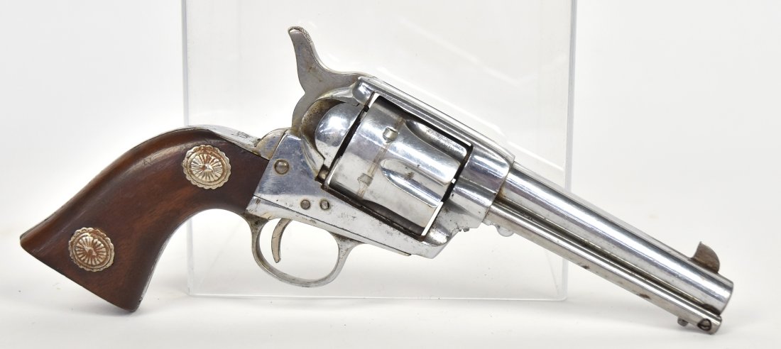 Old Spanish Copy of Colt Single Action Revolver: .44 caliber, 4.75"-barrel length, S/N 14410. Faint Colt markings in single line on top of barrel and marked Cal. .44 on the left side of the frame. 8 shot fluted cylinders with walnut grips with conch