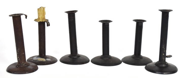 Six Early Hog Scraper Candlesticks: Wrought iron and tin all with pushups, including one pair, between 3 5/8 & 4" diameter x 5 1/2 & 7 1/4" high. Condition two missing pushups.