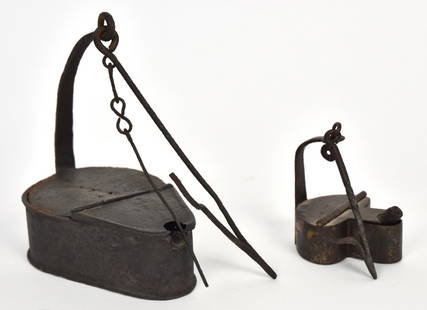 Two Wrought Iron & Tin Betty Lamps: Each with wrought hanging hook, larger in tin with wick pick on chain, both with nice brown patina, 4 3/4 x 3 1/4 x 5 1/2" high with 6 1/4" long hanging hook; iron example is spade form, 2 x 2 1/2 x2