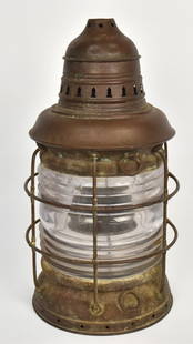 Large Brass Ships Lamp: Cylindrical with brass heavy gauge wire cage around clear glass, vent holes in domed top, nice brown patina, 9 1/2" diameter x 18 1/2" high. Condition missing burner, else VG.