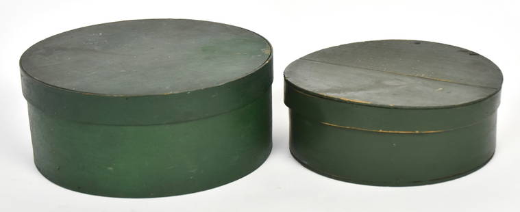 Painted Nested Pantry Boxes: Lidded set of two, spruce & white pine, in original green painted finish, largest is 8 3/4" x 3 1/2" high, smaller is 7 1/2" diameter x 3" high. Condition paint circa 97-94%.