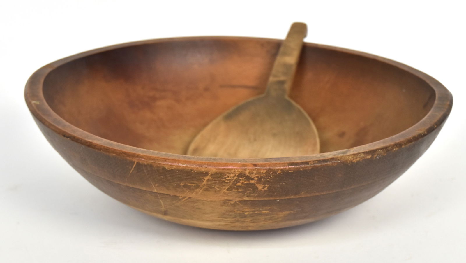 Fine Maple Treen Bowl & Butter Paddle: Nicely turned with 1 12" stepped lip on exterior, fie patina, 15 1.4 x 14 3.8 x 4 14" high; plus nicely carved butter paddle with fine scrubbed patina, 9 1/8" long. Condition both Fine.