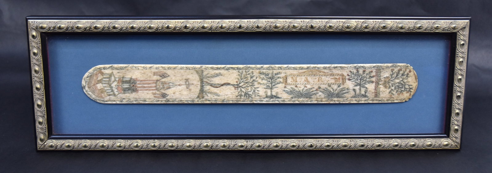 Outstanding Scrimshaw Corset Stay: Whale bone with original polychrome pigments from base with has a church steeple/clock tower flying American and Grand Union flags with whale weather vane above, under tree of life with entwined serpe