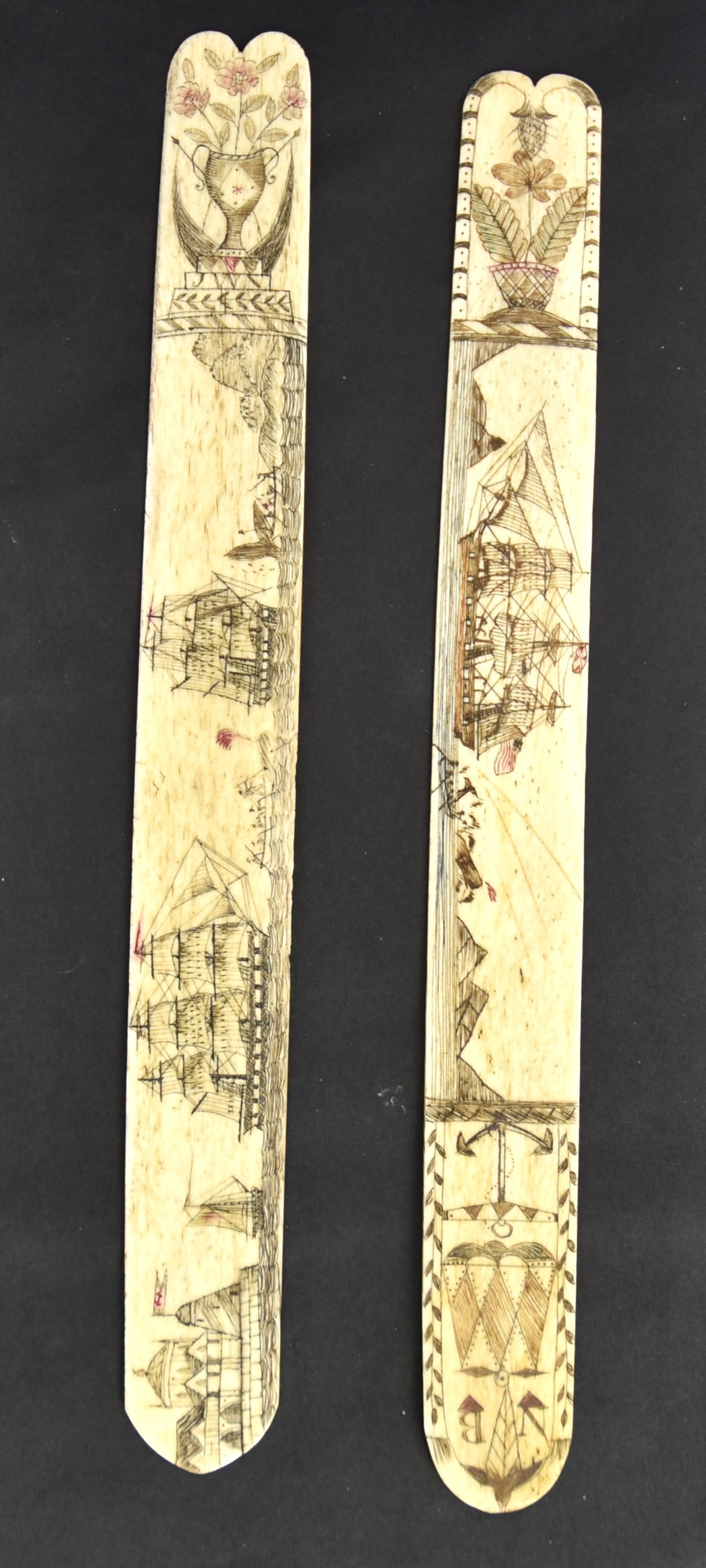 Two Scrimshaw Corset Stays: Busks both in whale bone with polychrome pigments one with whaling scene with one whale boat hunting sperm whale with whaler flying U.S. flag, islands in background, basket of flowers left and anchor 