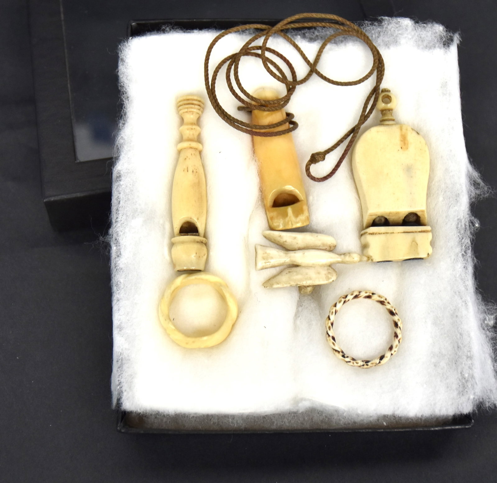 Scrimshaw Rings & Whistles: Lot of six all whales tooth or bone including ring with dove in flight and two rope carved rings and three whale tooth or bone whistles, bird 1 1/4" long whistles2 1.8; 1 34; & 2 1/8" long. All with n