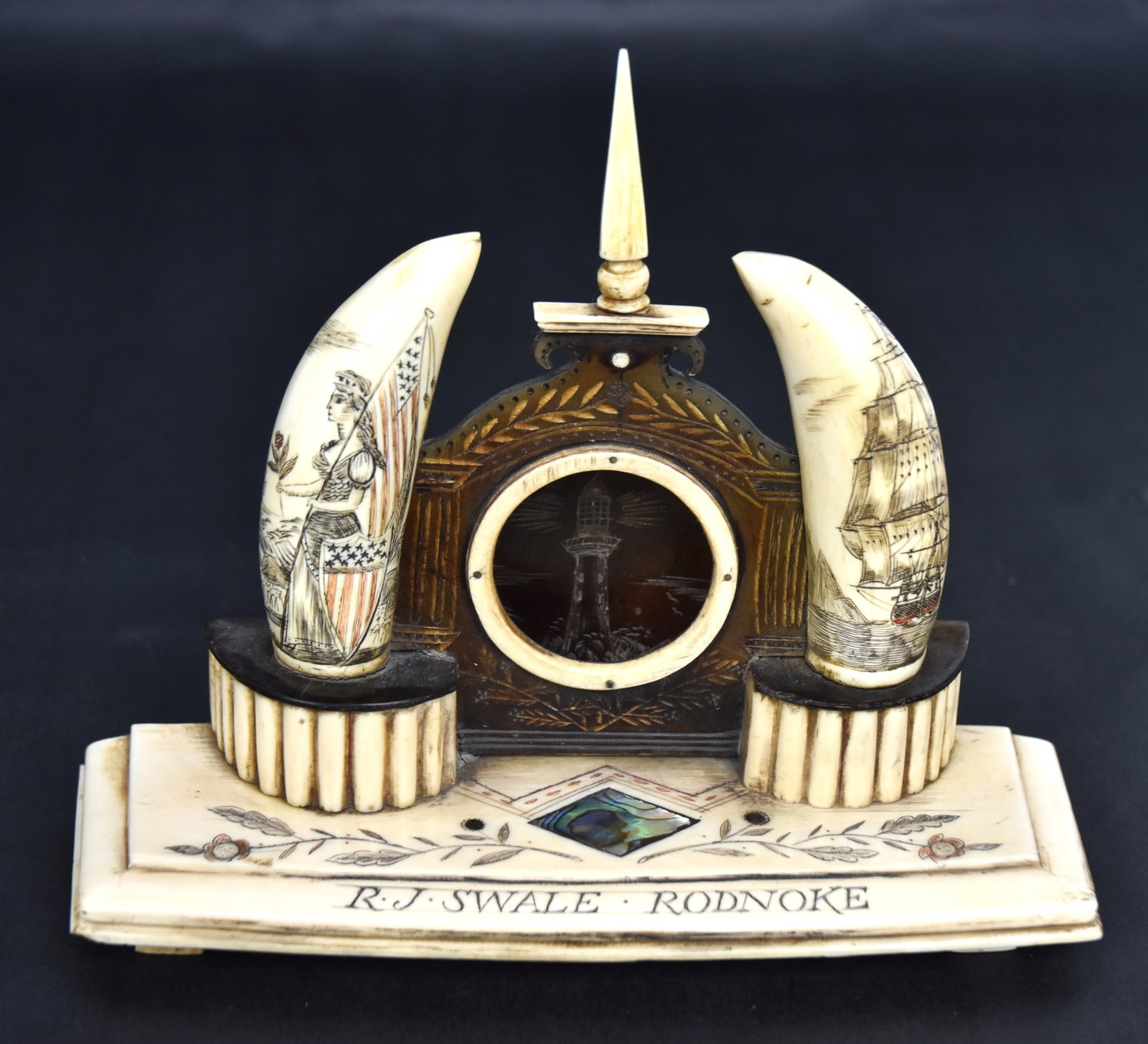Fine Scrimshaw Watch Hutch: Whales teeth, baleen, abalone and polychrome paint/ink with baleen arch with engraved fluted columns with laurel branches arched above and tapered whale bone finial with whale tooth surrounding hole w