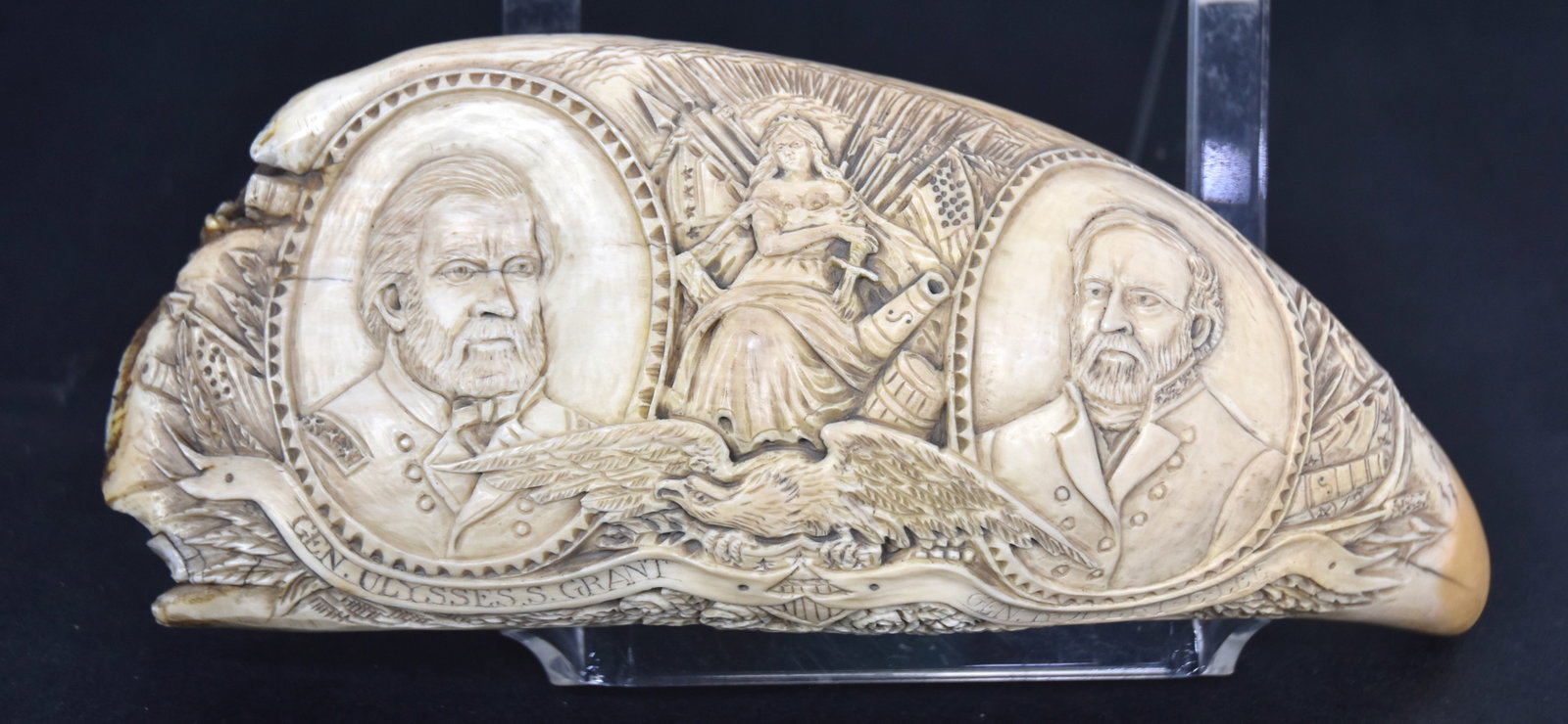 Grant & Lee Carved Scrimshaw Sperm Whale Tooth: Carved on one face with oval shoulder length uniformed portraits each identified on ribbon banner below, flanking seated Lady with crossed arms and flags behind with spread winged eagle clutching U.S.