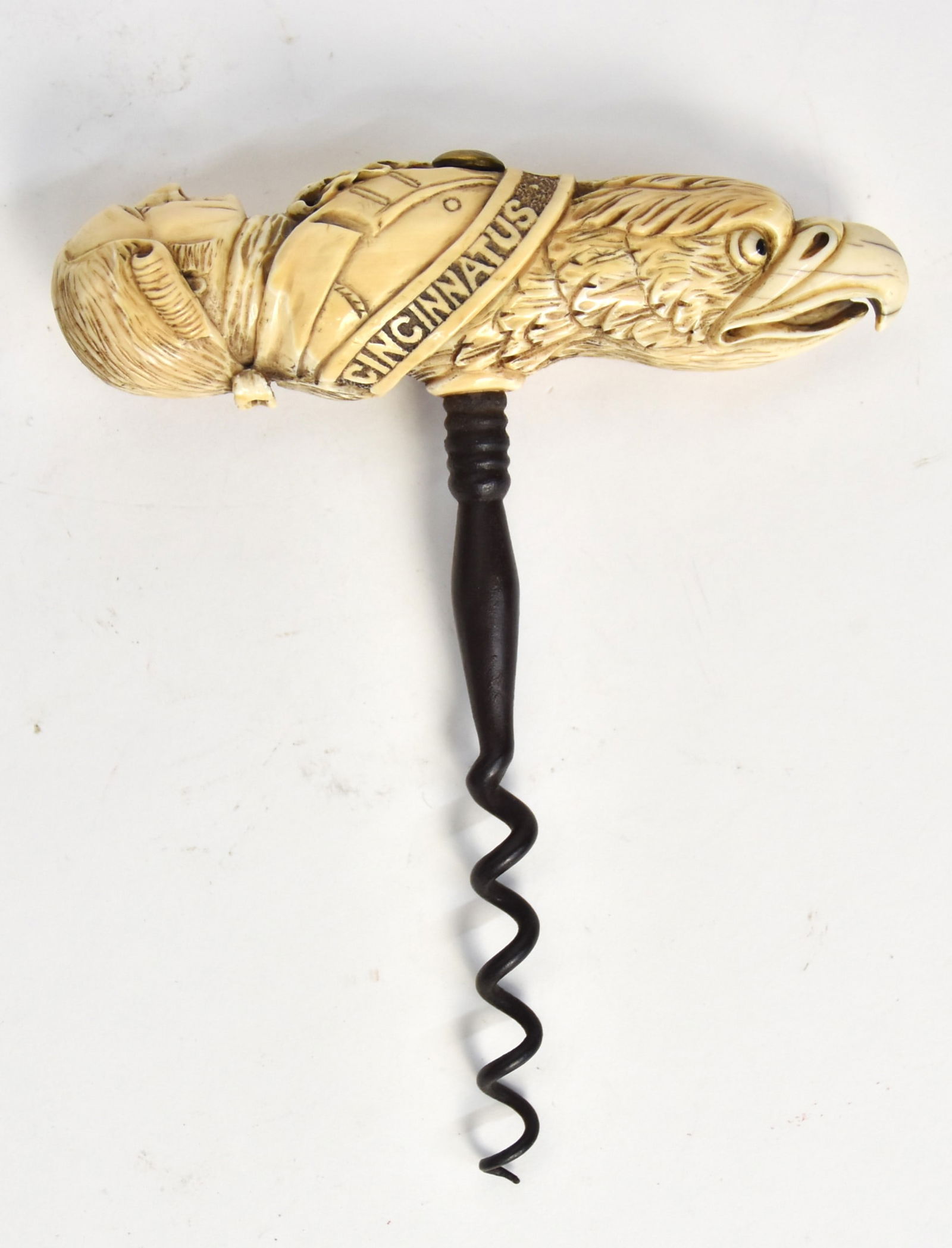 Relief Carved Scrimshaw Corkscrew: Whale tooth, wrought iron and brass with grip carved with shoulder length uniform bust of George Washington with ribbon banner below with carved inscription Cincinnatus Lucius Quinctus (name of the Ro