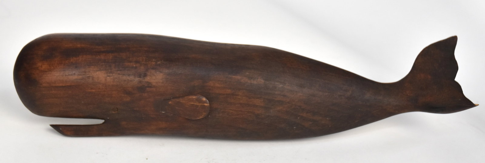 Folk Art Carved Sperm Whale: Linwood? with open mouth and turned tail, nice patina, 11 3/8" long. Condition Fine.
