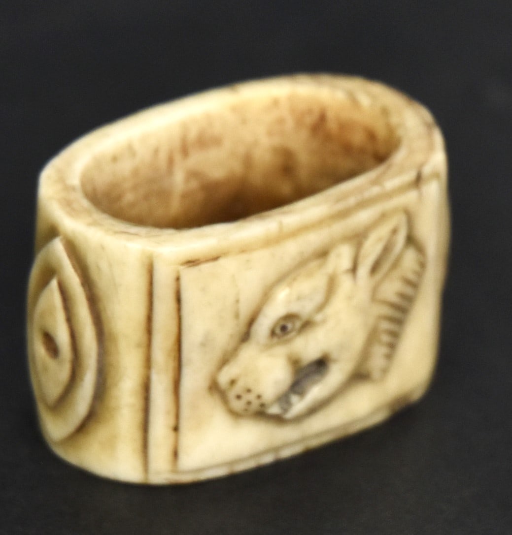 Civil War Louisiana Tigers Bollo Slide: Carved bone with female tigers head facing left on one side engraved on reverse: New Berne/Nth Carolina/1863 with sides having stepped ovals, 1 1/2 x 1 x 15/16" high. The CSA Louisiana Tigers were a s