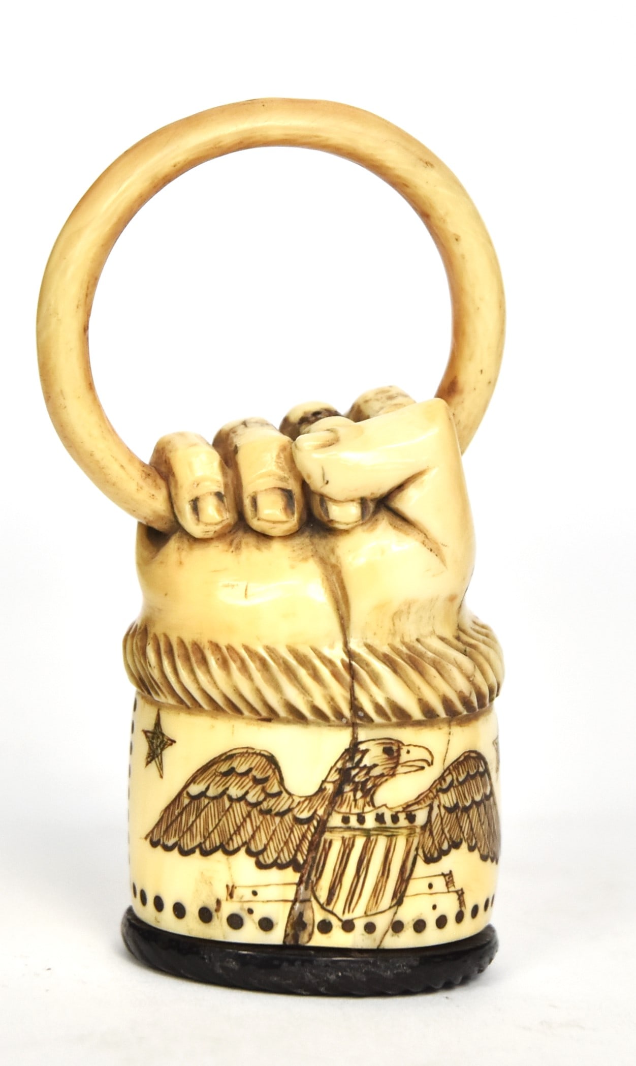 Fine Figural Scrimshaw Snuff Box: Whale tooth, horn & abalone with carved clenched fist motif, clutching ring, with back of hand engraved with initials T.L., cuff with carved rope top, over engraved with spread wing U.S. shield breast