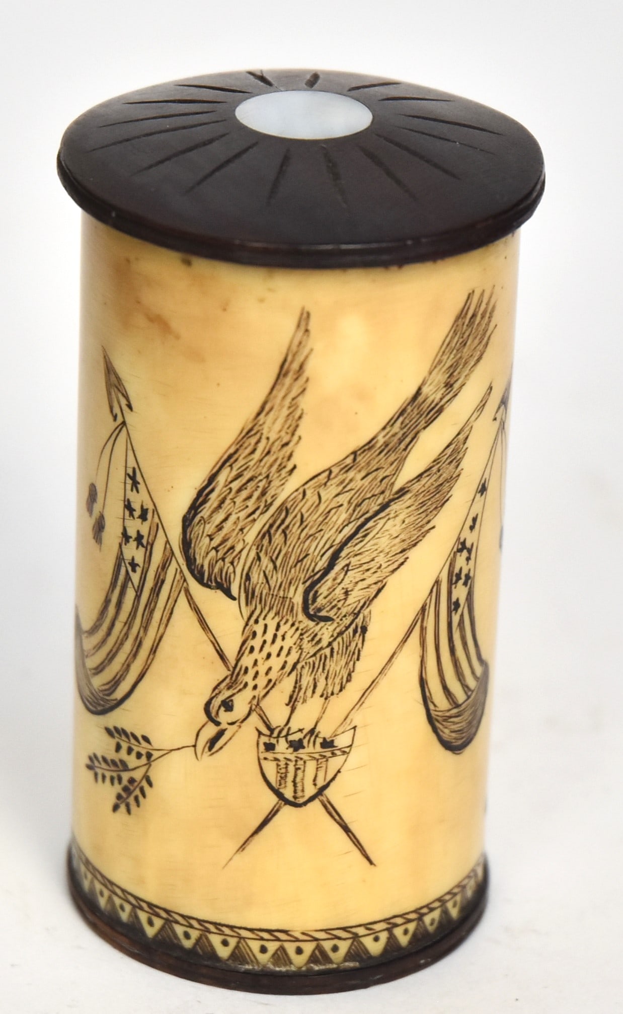 Fine Scrimshaw Box: Walrus, ebony & MOP cylindrical form with carved shield engraved Captain/Thomas/Jones/Brazil/Sag Harbor with engraved ribbon banner behind with 1839 flanked be laurel branches, reverse with engraved e