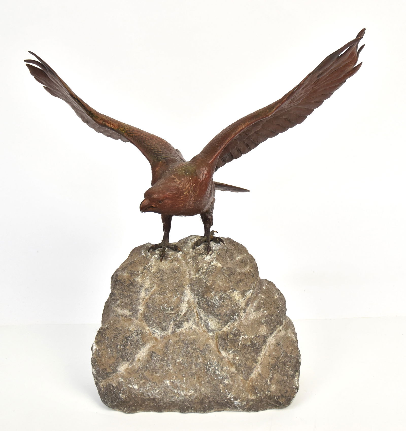Franz Bergman Bronze Eagle: Spread wing eagle perched atop a piece of granite, marked on underside of tail with amphora mark,Geschutzt & 4485, 14 x 7 x 15 1/2" high. Condition Fine.
