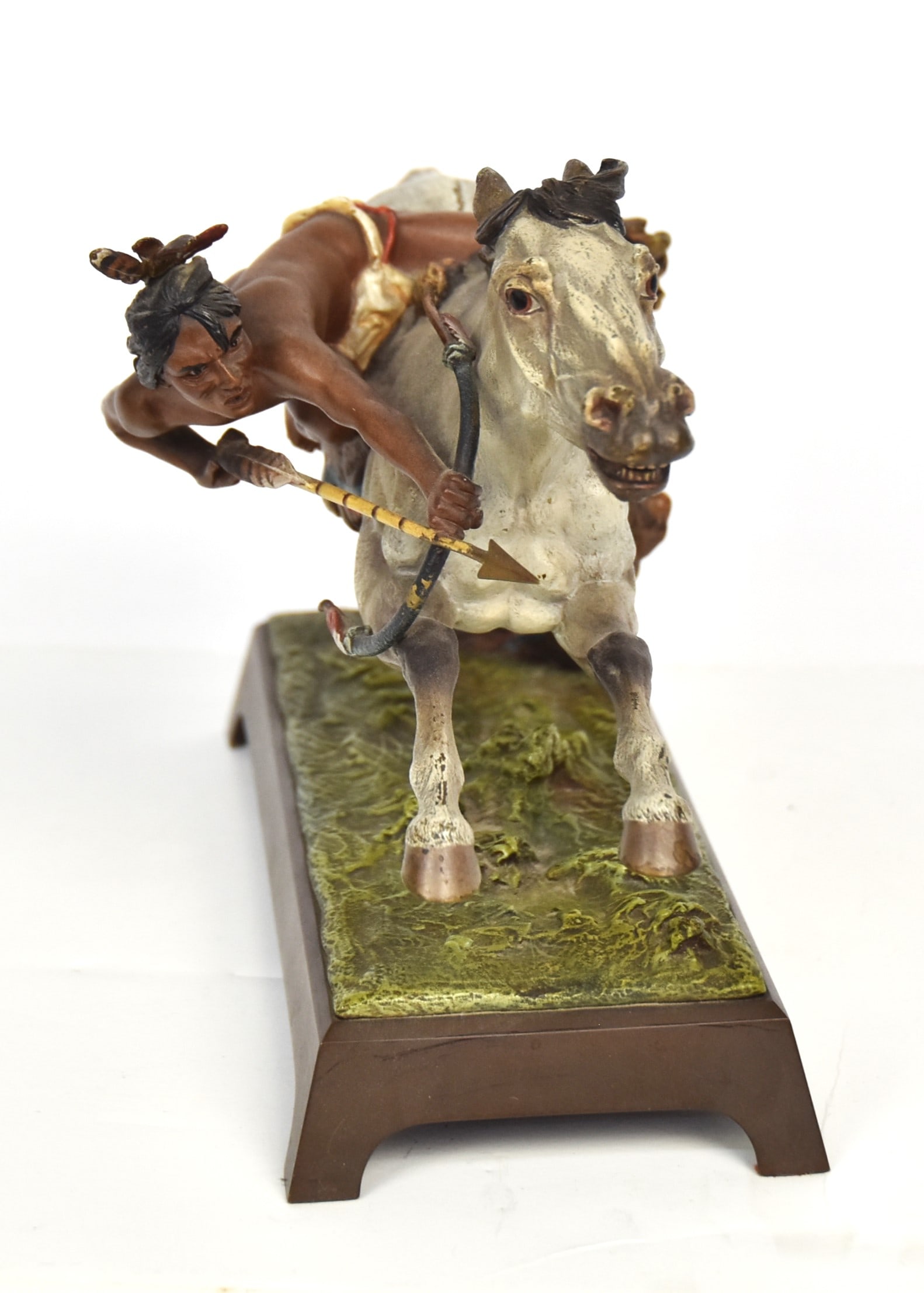 Franz Bergman Native American Cold Painted Bronze: Austrian, depicting mounted Native American warrior/hunter shooting arrow on rectangular bronze base, marked on underside of horse impressed amphora B mark Geschutzt & 3605, 12 1/2 x 4 x 7 1.4" high. 