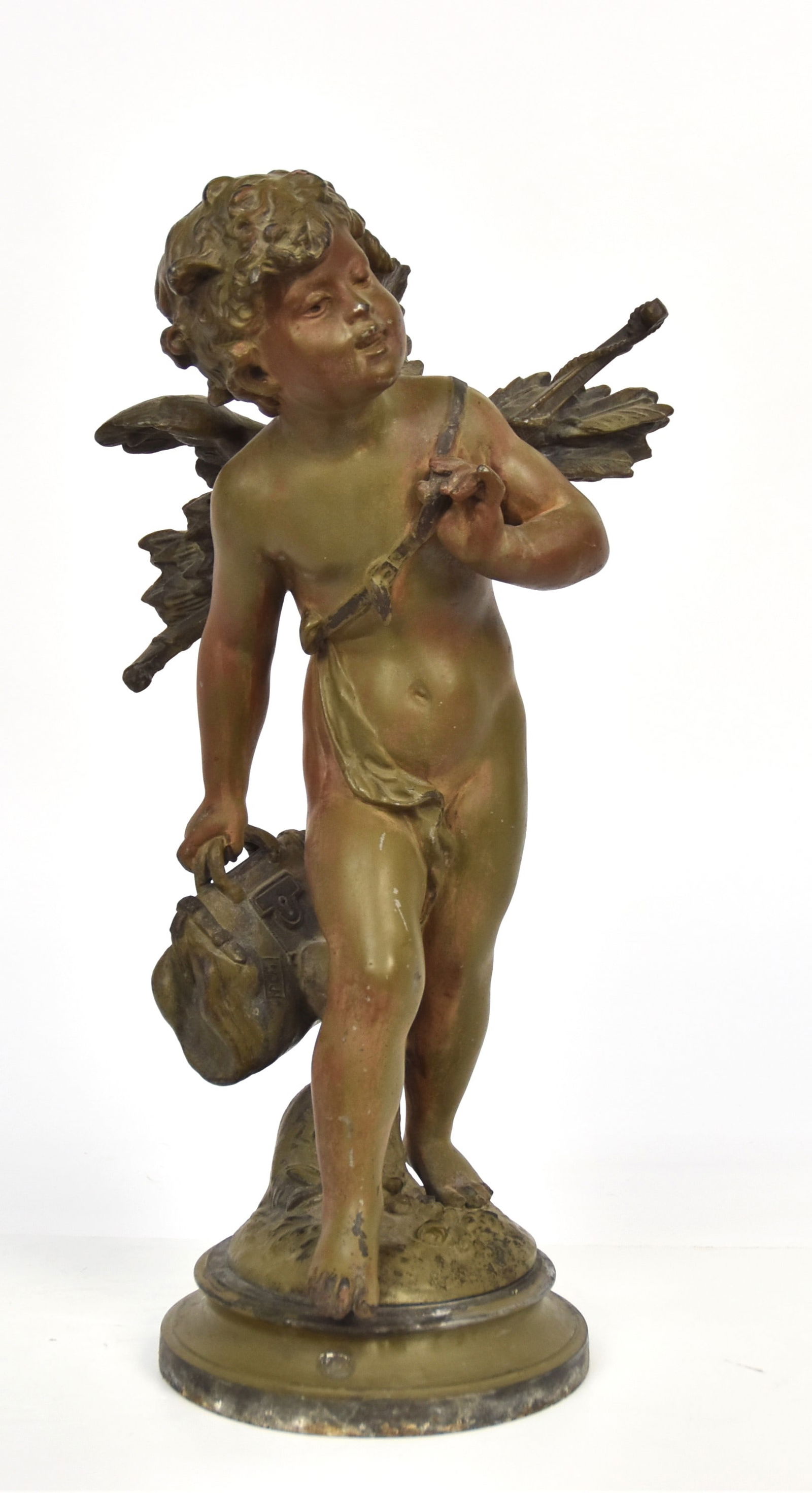Bronzed Figure of Young Cupid: Bronzed white metal with winged nude Cupid with bow and arrows across back and holding a leather brief case in right hand, on round base, artist signed Moro, 10 1/2 x6 1/2 x17 1/2" high. Condition fin