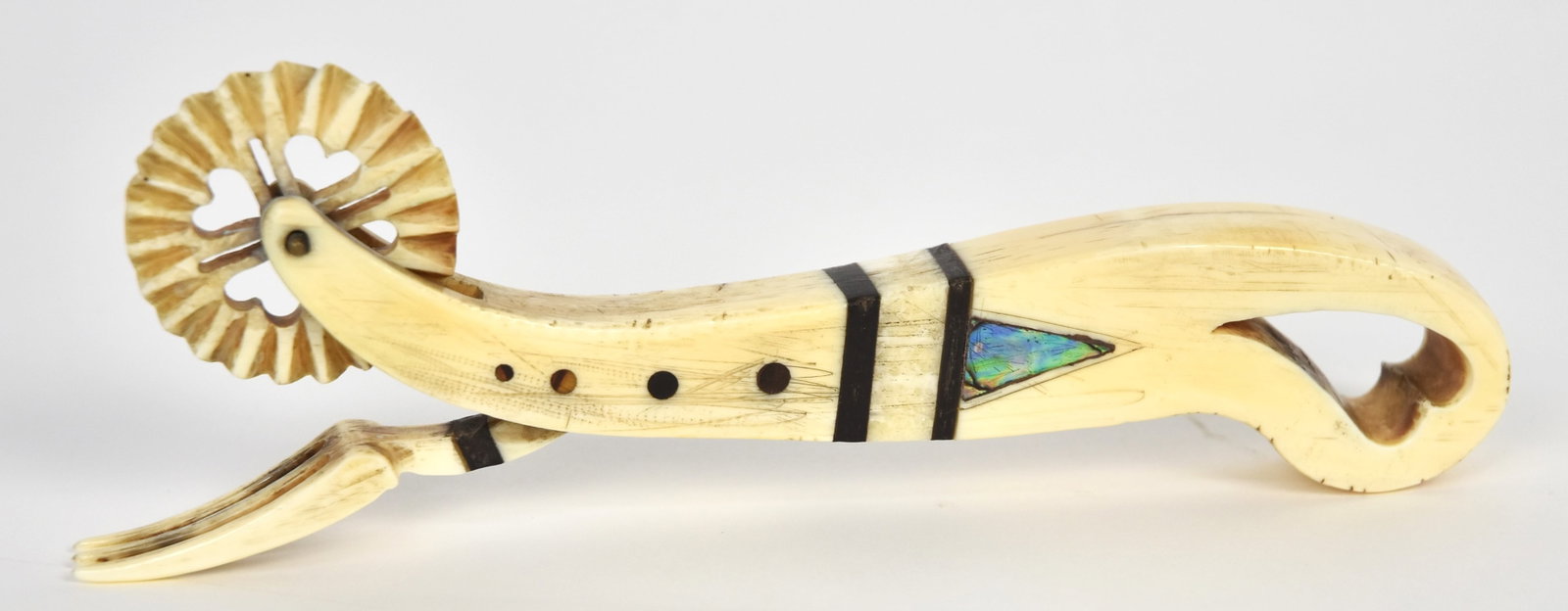 Fine Scrimshaw Jagging Wheel: Pie crimper, walrus, baleen & abalone with cut-out fluted crimper wheel, three tine testing fork above with baleen band, grip with cut-out heart, inlaid baleen dots and bands and inlaid abalone triang