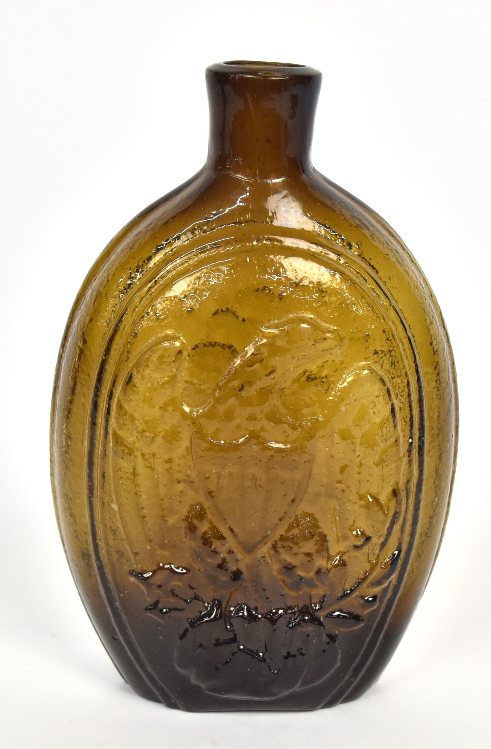 Olive Green Eagle & Cornucopia Flask: Obverse spread wing U.S. shield breasted eagle clutching arrows and laurel branch in talons, reverse with cornucopia with fruit and 4-pointed star left, snap pontil and fire polished lip, 7" high. Con