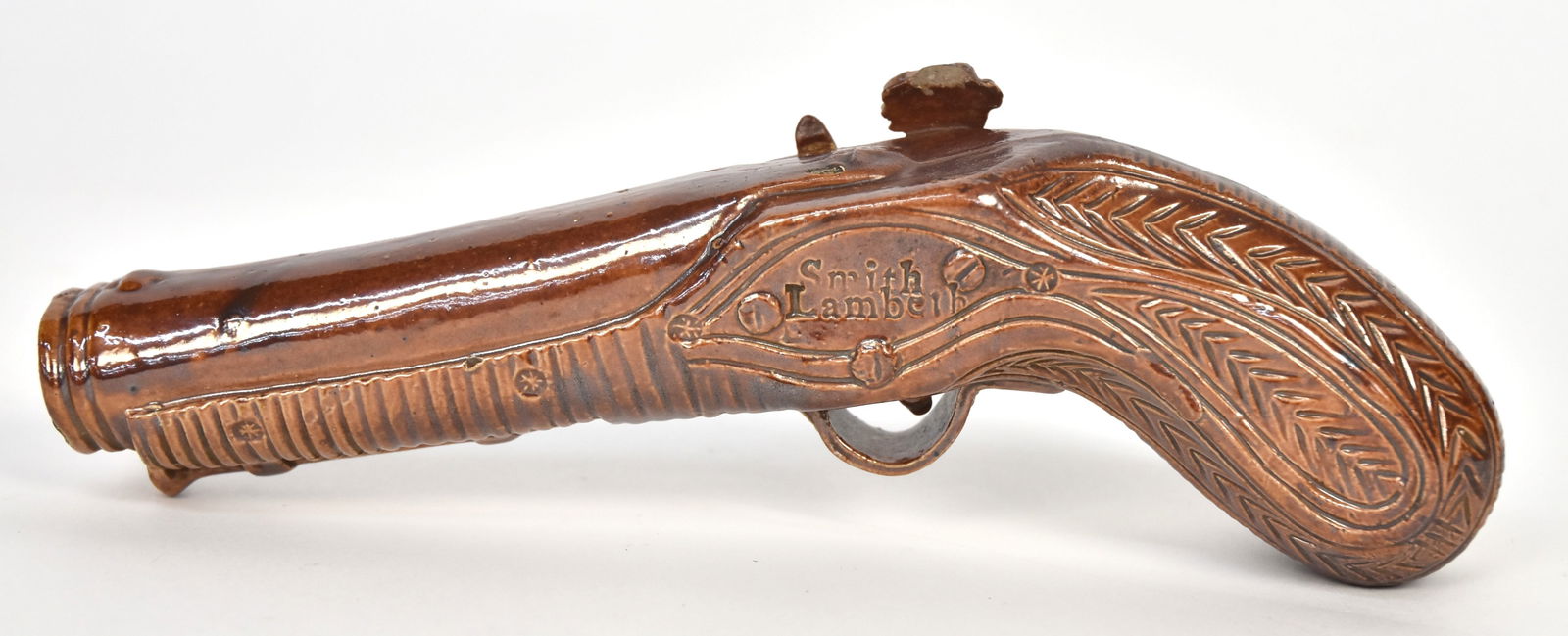 Smith Lambeth Pottery Pistol Flask: Flint lock type marked as above on right side, 8 1/4" long. Condition Fine.