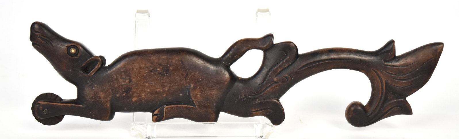 Folk Art Fabric Marking Wheel: Carved rosewood in the form of cow with inlaid white bead eyes, fluted marking wheel between front feet and floral scroll handle extending from rear, fine old patina, 12 1/2" long x 3 1/8" high. Condi