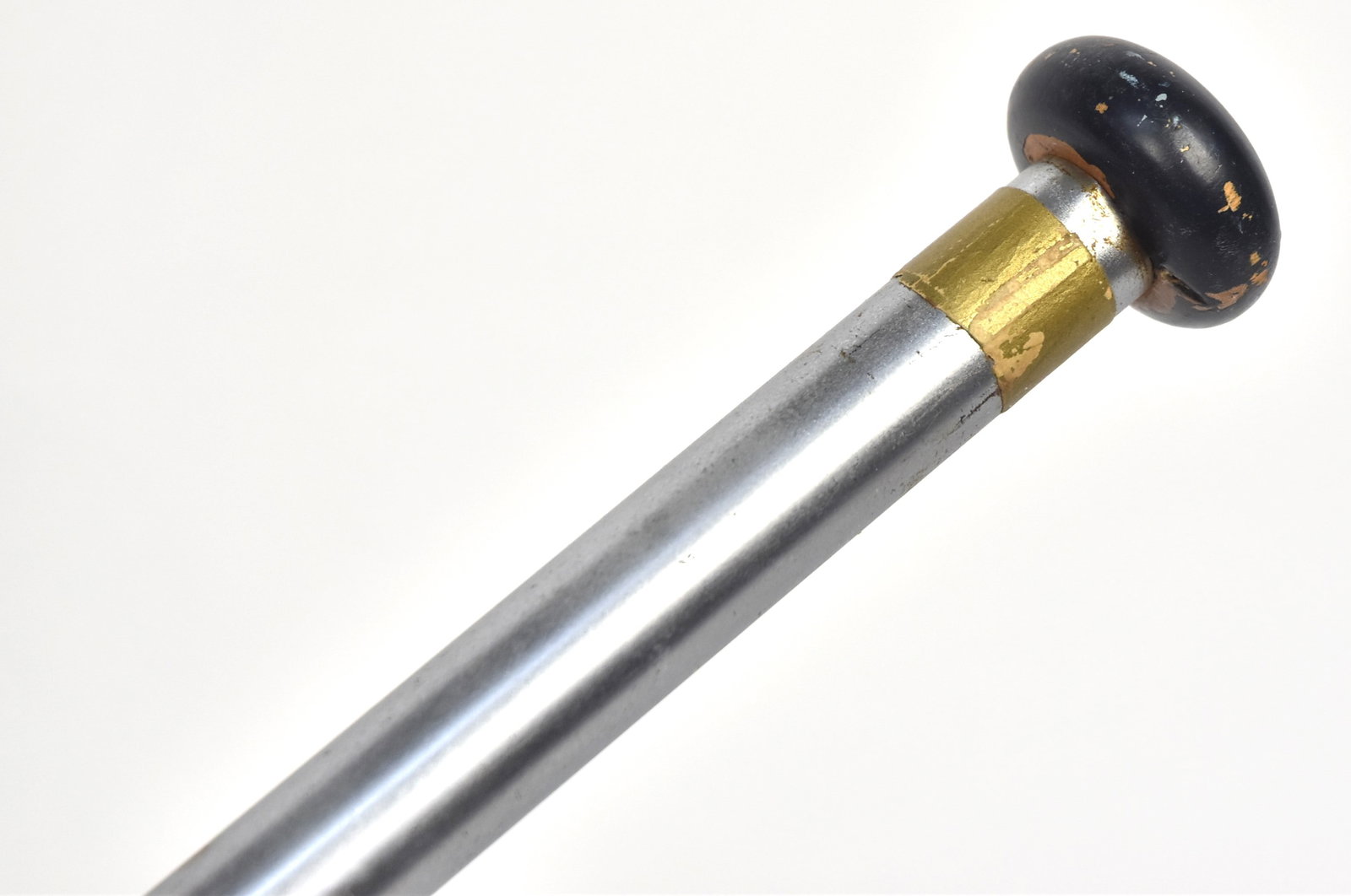 Gadget Parade Flag Cane: Brushed steel tapered shaft with turned blue painted wood knob that that when removed reveals a cotton printed U.S. flag 16 3/4 x 11 1/2", attached to steel rod with printed paper label: Yendes Servic