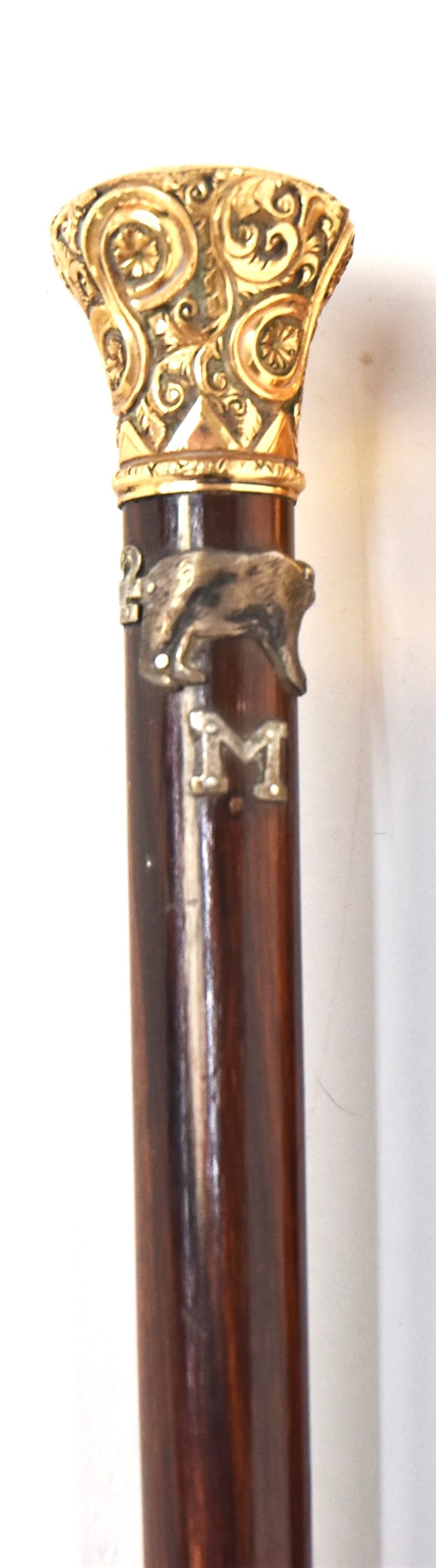 Presentation Cane: Gold filled 1 1/8" high floral chased knob engraved From C.P. to J.V.P. with coin silver relief walking bear and band with 2 and letter M, all mounted on e rosewood shaft with 1 1/4" bone ferrule, tot