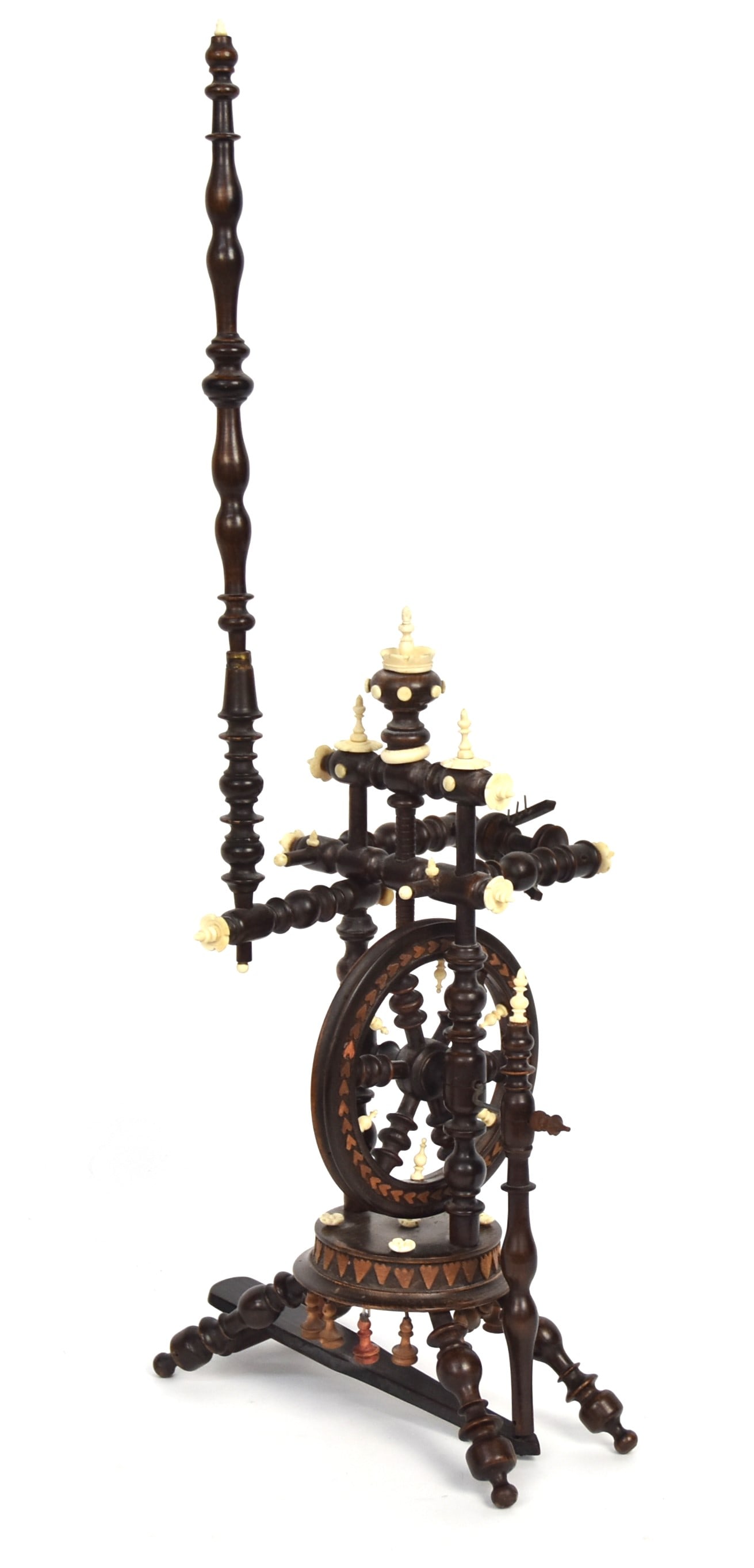 Miniature Rosewood Scrimshaw Spinning Wheel: Beautifully made with relief carved hearts and turned whale tooth finials and flowers, working, 9 1/2 x 9 x 24 58" high with 5" diameter wheel. Condition Fine.