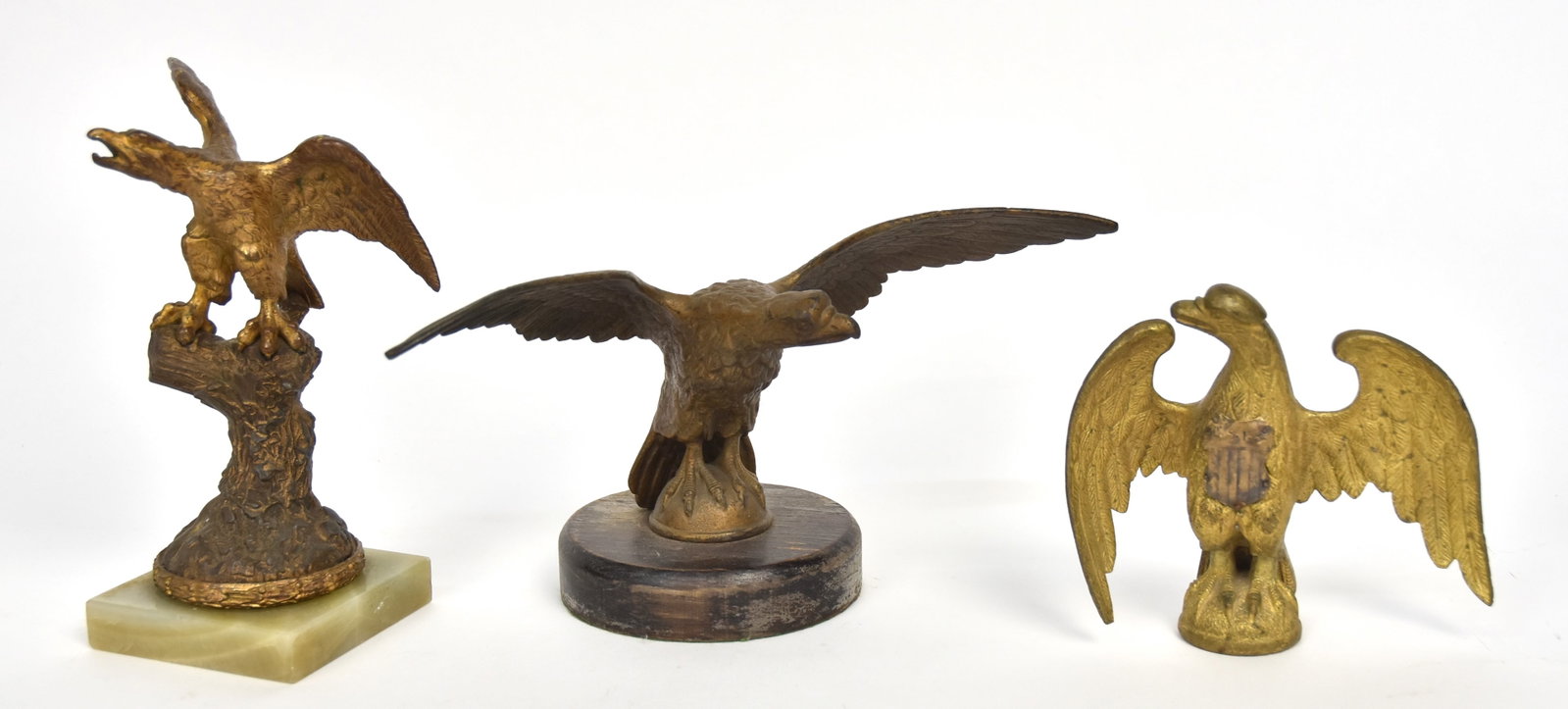 Three Cast Bronze Eagles: Two are flag pole finials, smaller with added U.S. shield on breast with U.S.I.S. (United States Indian Service), 6 x 5 3/4" high; 2nd 11 1/4 x 5 1/2 x 6" high, mounted on oak base; and eagle perched 