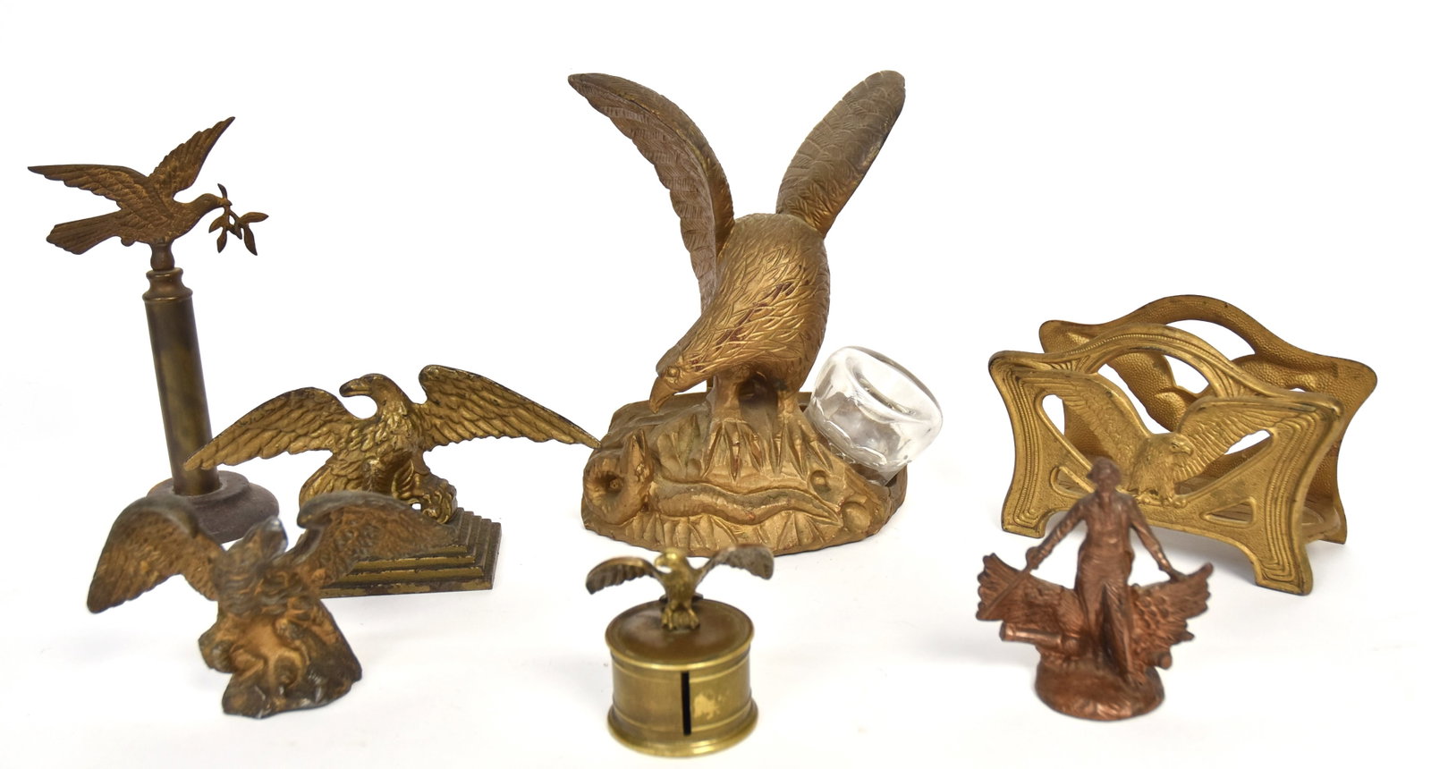 Group of Eagles: Lot of seven, including a fine 19th century folk art carved perching spread wing eagle with snake ink well stand with glass inkwell, in original gold painted finish, 6 x 3 3/4 x 8 1/4" high; plus bras