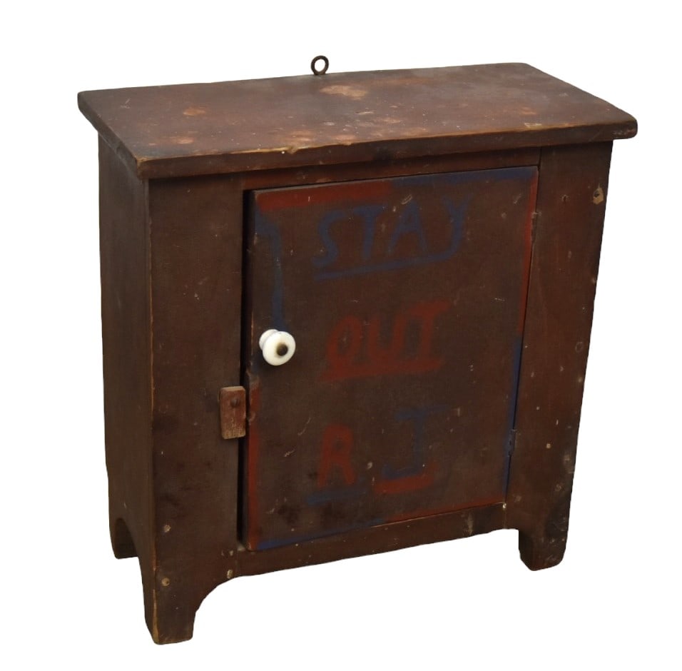 Painted Miniature Cupboard: Made from old Ivory Soap boxes with two shelf interior having black stenciled labels, overhanging top over single solid door with porcelain knob and wood hasp, scroll cut-out apron and boot-jack ends,