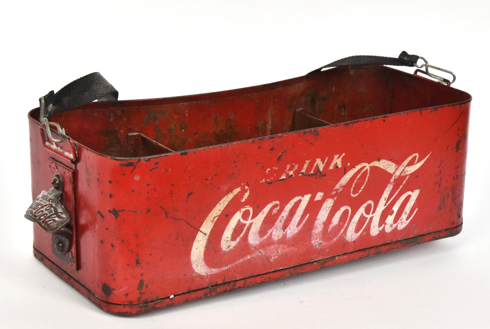 Ballpark Coca-Cola Vendors Cooler: Circa 1930-40 in red painted steel with white text on front reading: Drink/Coca-Cola in script, rounded corners and back for resting against vendors belly, interior with three chambers, wire bale hand