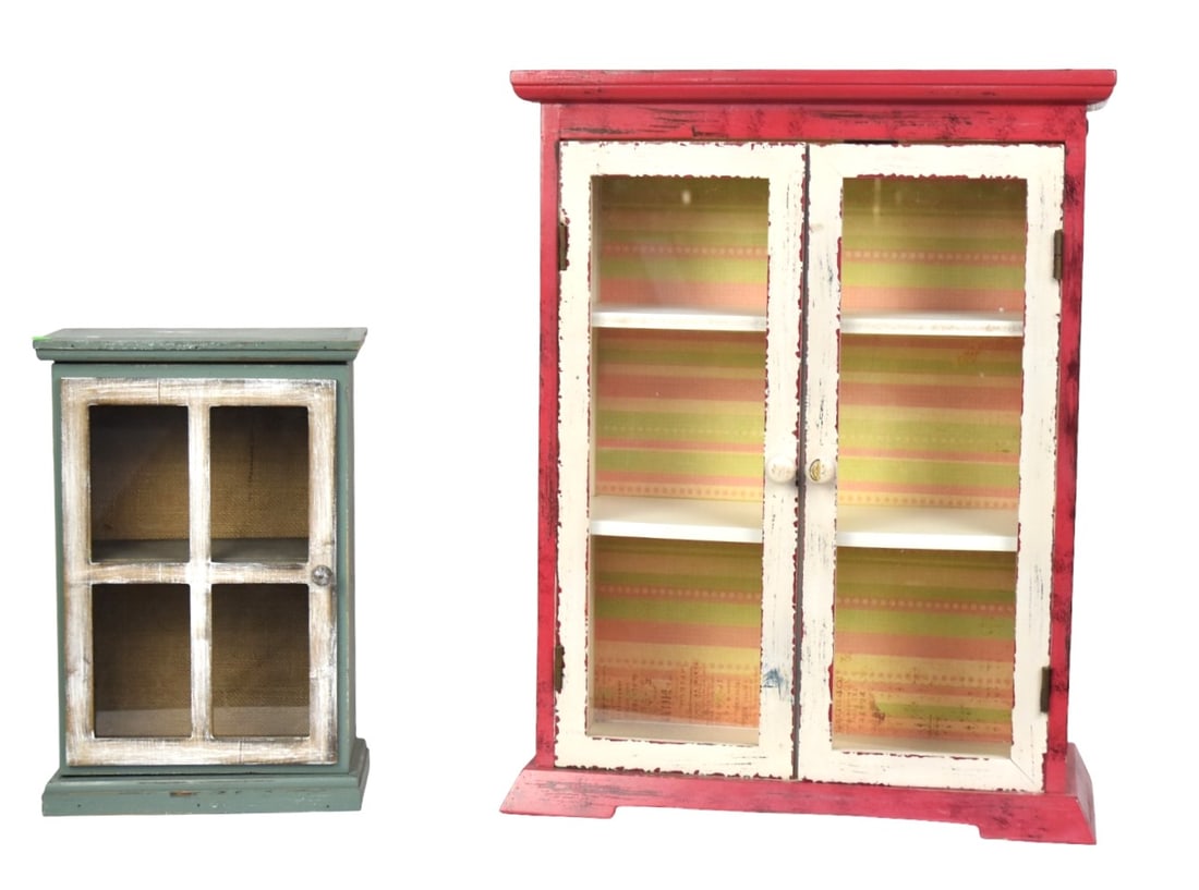 Painted Store Display Case Plus: Lot of two including a wood and Masonite store counter top display case with overhanging cove molded top, over two glass doors, with turned wood knobs, solid ends and bracket base, interior with three