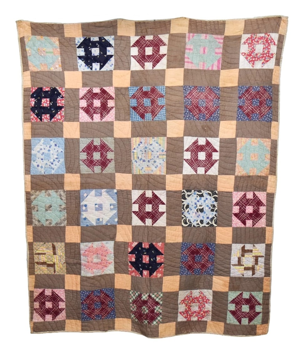 Early Pieced Quilt: Circa 1900-1920s triangle and square pattern, all hand quilted, 67 x 81 1/2". Condition minor stains, mainly on back.