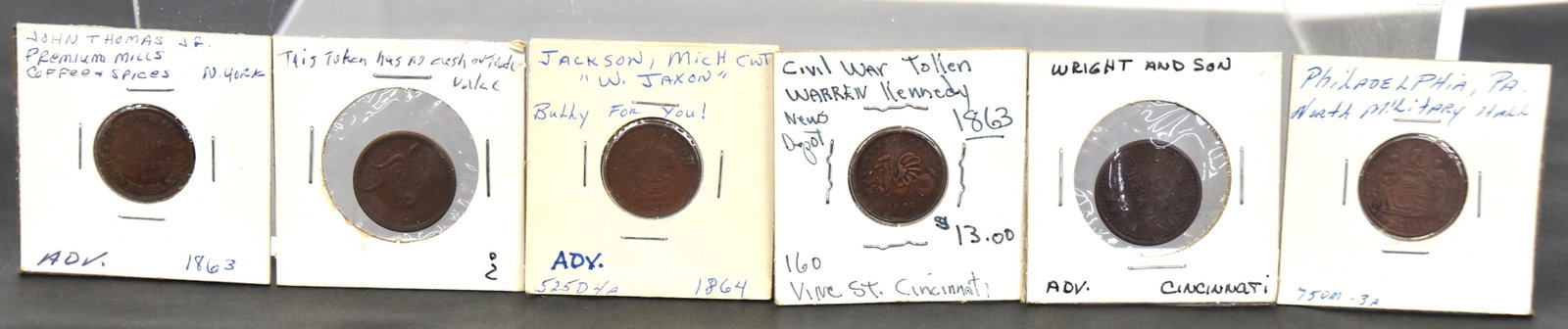 Group of Copper Civil War Tokens: Lot of six, all Indian Head penny size, including Wright & Son, Cincinnati, 119 Oper Pl. We Make Checks; plus 1865 Warren Kennedy New Depot 160 Vine St.; plus 1864 Bully For You, W. Jaxon Grocer, Jack