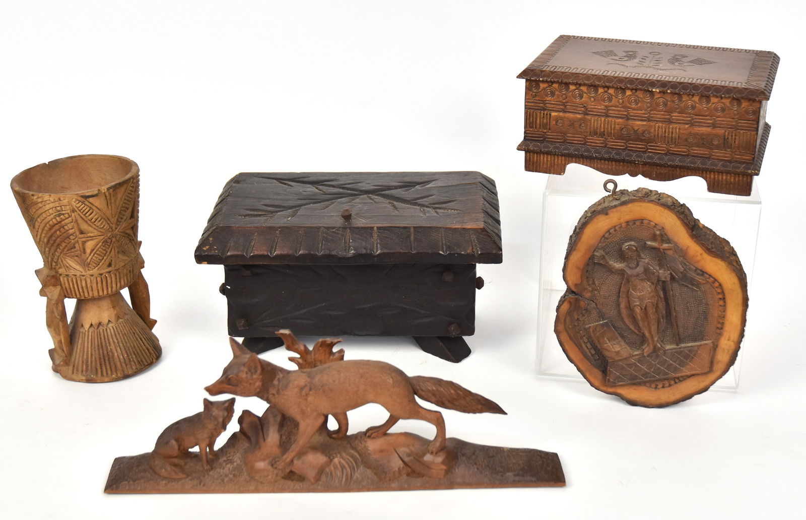 Folk Art Wood Carvings: Lot of five, including a nice Arts & Craft oak hinge lidded box with stylized floral carving and rose head wrought iron nails, in dark original finish, 9 x 5 3/4 x 5 1/2" high; plus beautiful Black Fo