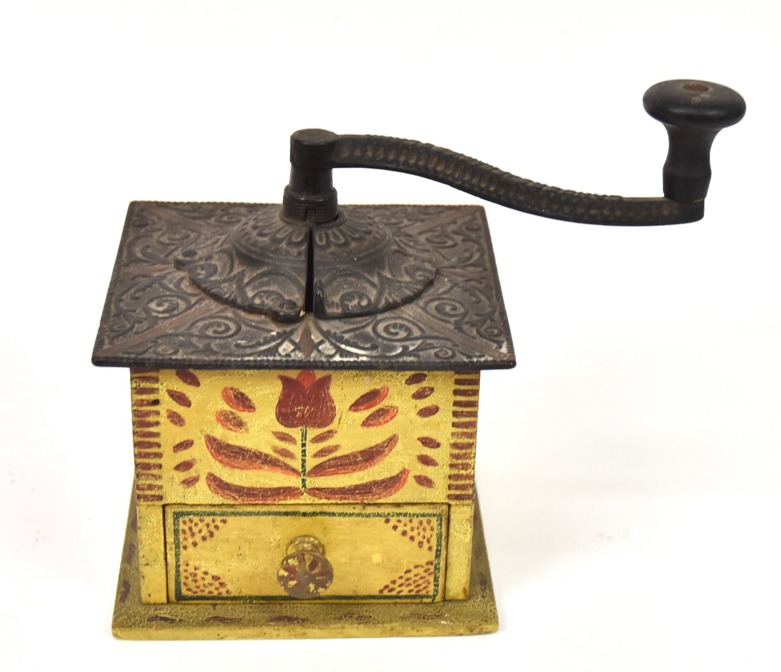 Decorated Coffee Mill: Dovetailed wood in old polyhrome painted Tulip flower decoration on front and sides, cast iron top with scroll work, brass knob on drawer, 6" square x 8 1/2" high, nice old patina. Condition paint cir