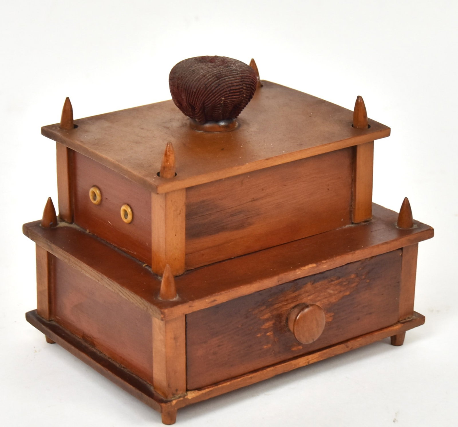Shaker Sewing Box: Mixed woods with fabric covered pin-cushion on lid, eight eyelets for spool thread and single drawer below in original varnish finish with pencil inscription reading December 20th 1870, 7 x 5 1/2 x 6 