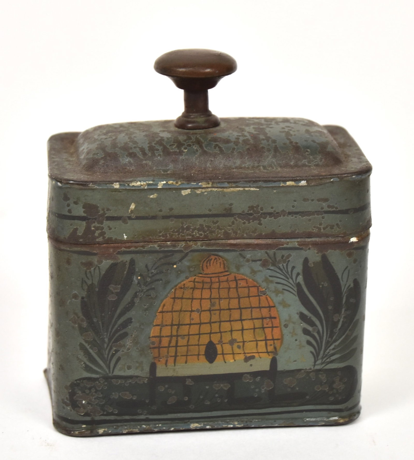 Early Paint Decorated Tea Caddy: Rectangular with rounded corners and stepped hinged locking lid, with green ground and polychrome leaves and bee keep on front with brass knob finial,3 x 2 x 3 3/4" high. Condition paint circa 80%.
