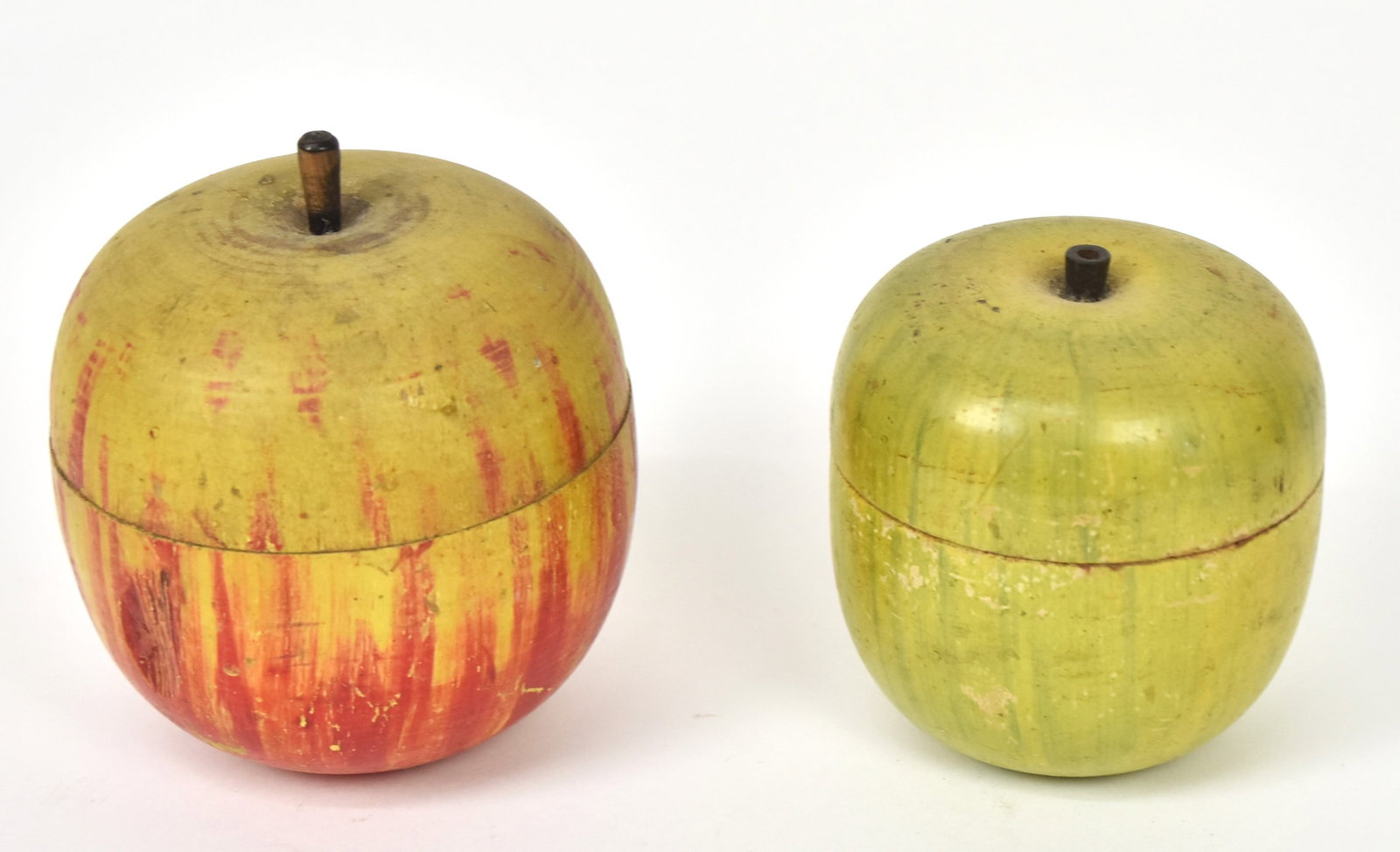 Two Apple Tea Caddies: Both turned maple in original polychrome painted finish with stems, 4"diameter x 5" high & 3 1/4" diameter x 4" high. Condition Both VG.