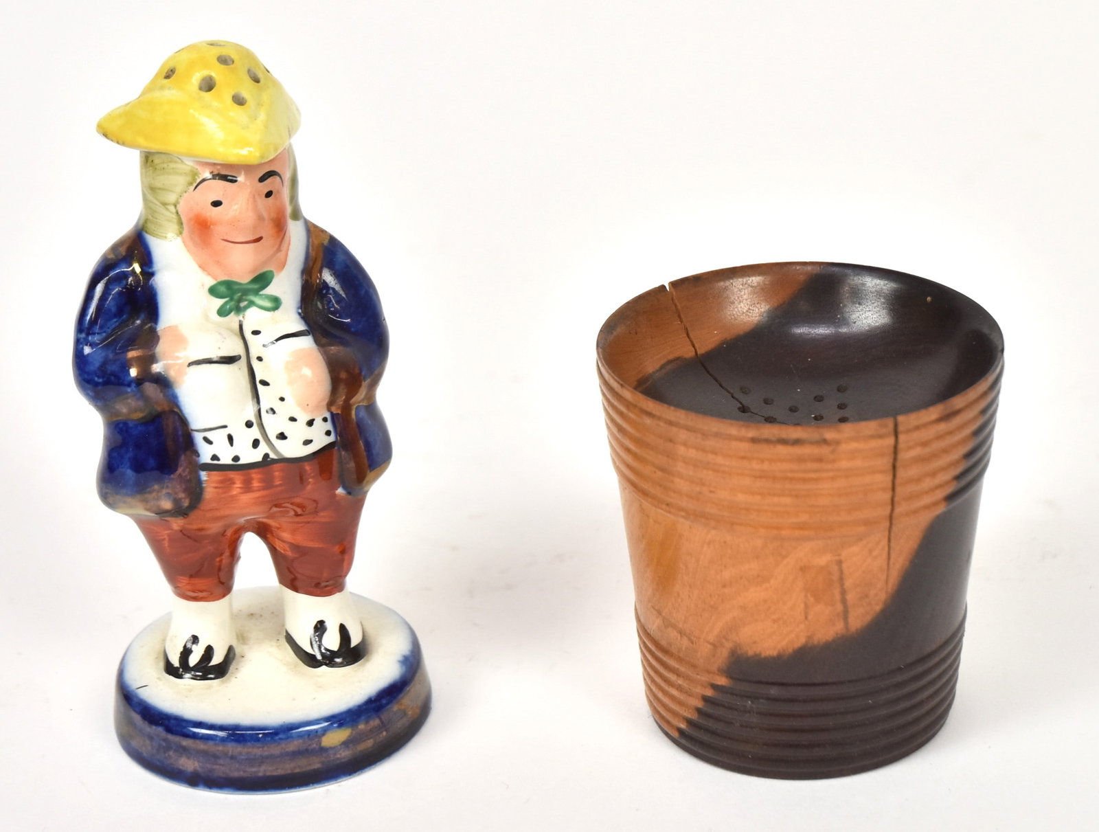 Staffordshire Caster & Treen Sander: Lot of two including a figural polychrome hand painted caster in pearlware, 5" high; and lignum vitae wood turned sander, 2 34" diameter & high. Condition 1st VG+; 2nd with shrinkage line, still VG.