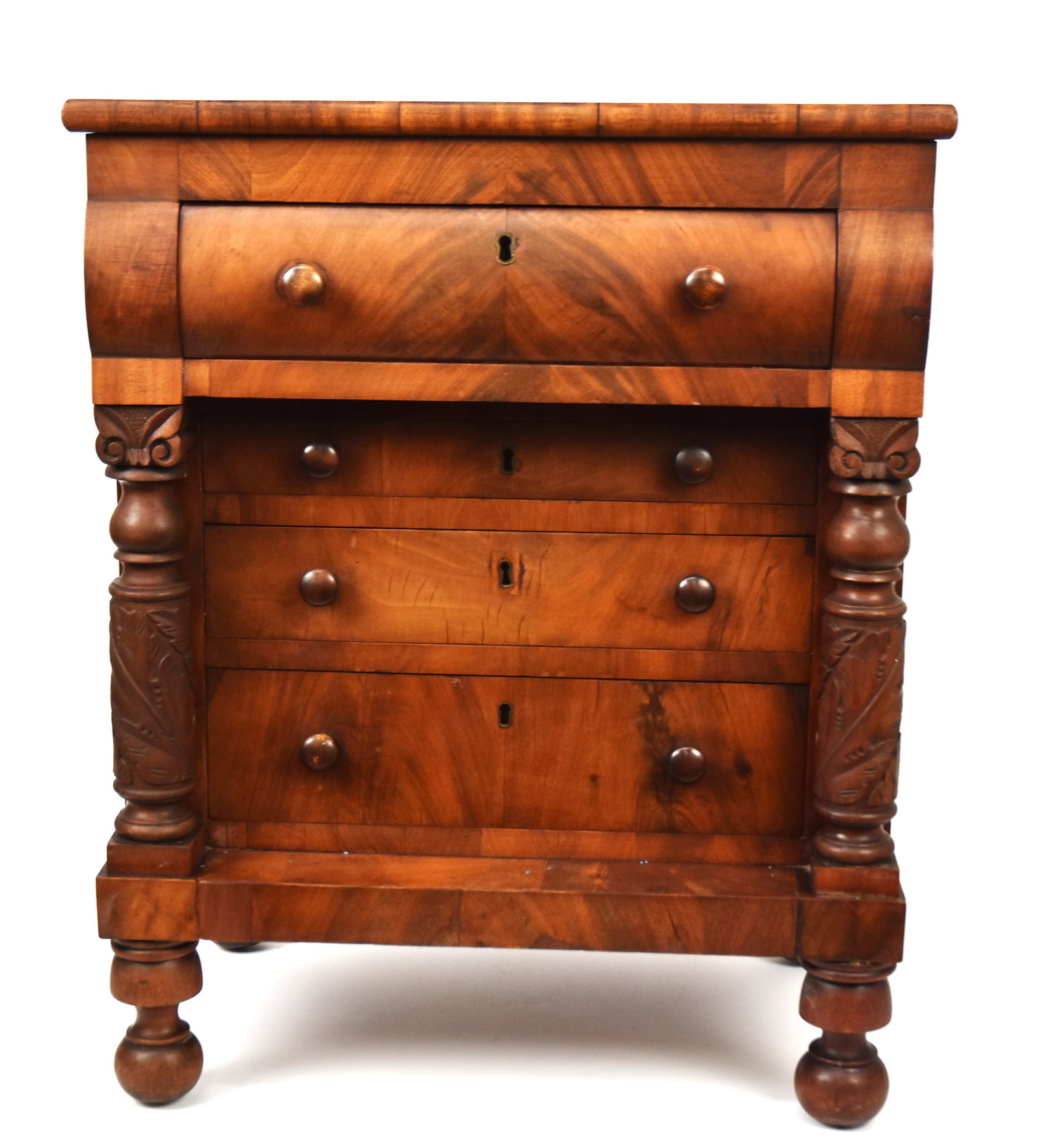 Fine Penn. Cherry Miniature Chest: Circa 1830 with overhanging top, over overhanging top dovetailed drawer with book matched mahogany veneers front, over three graduated dovetailed drawers, all with original turned cherry knobs and loc