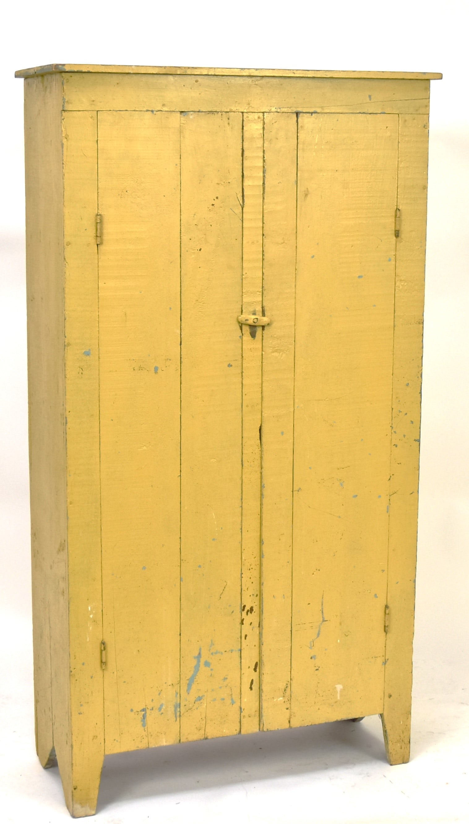 Small Yellow Painted Jelly Cupboard: Old yellow over blue primitive cupboard with two solid doors, with cut-out boot-jack ends, cut-out front feet, interior with four shelves, nice old patina, circa 1900. 29 1/2 x 12 x 54" high. Conditio