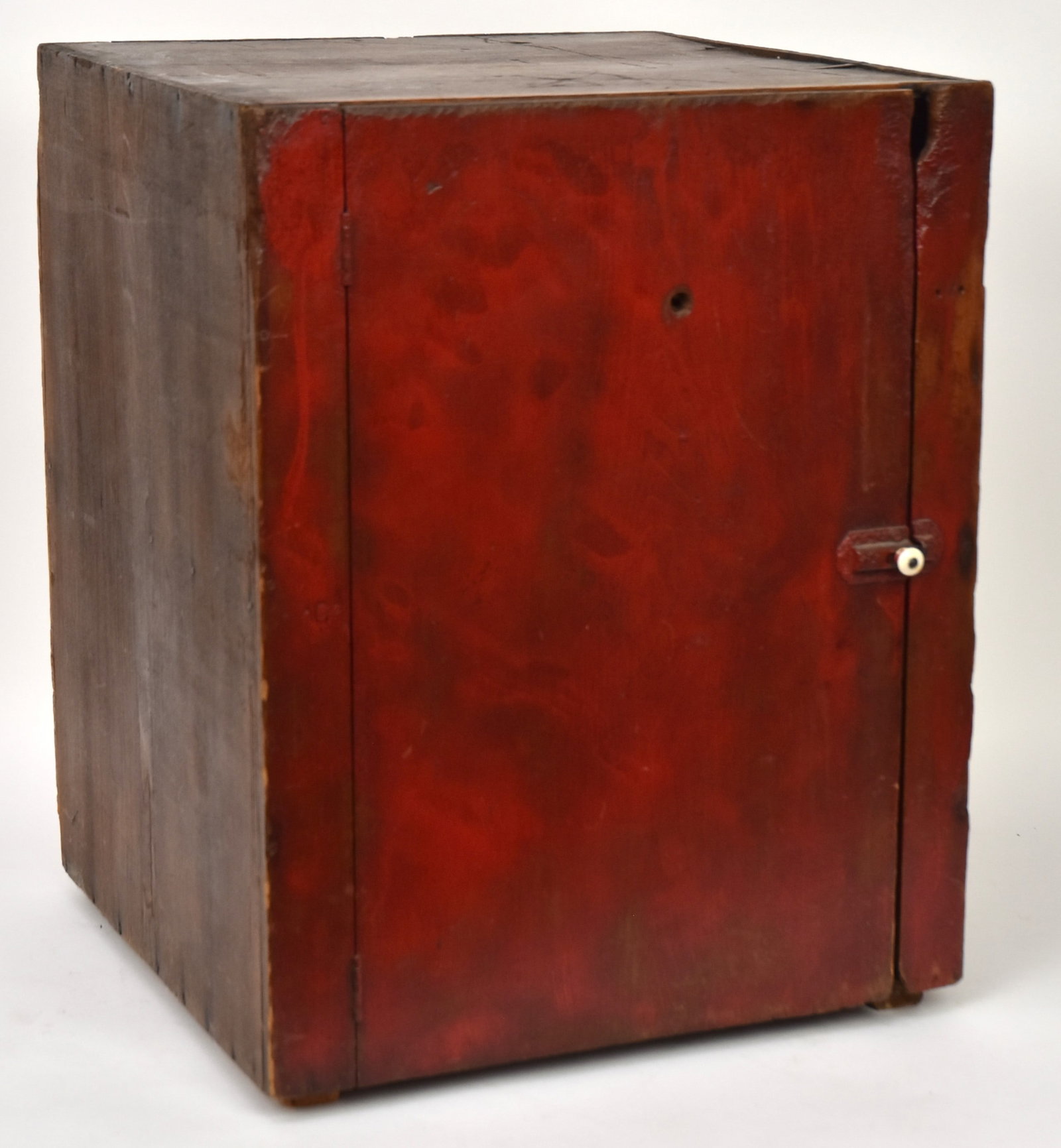 Primitive Red Painted Cupboard: Single door with cast iron hasp & keeper, front in old red painted finish, likely made for counter or table top or built in, 18 x 17 1/2 x22 3/4" high. Condition VG.