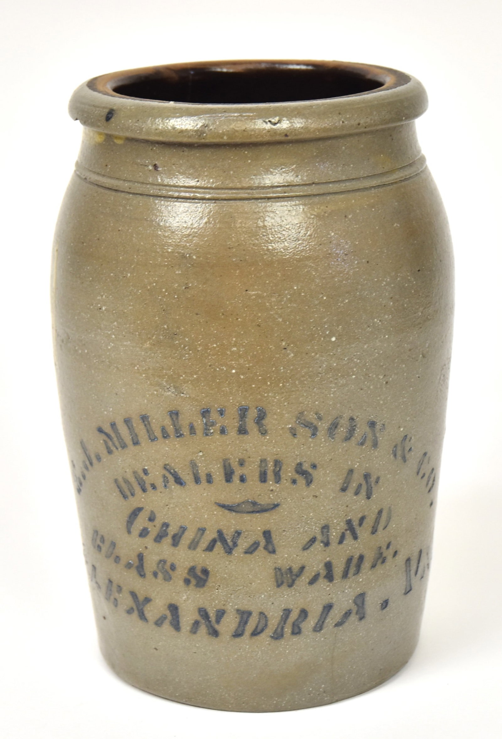 E.J. Miller & Son Alexandria Va. Decorated Stoneware Jar: Salt glaze with Albany glazed interior, slightly ovoid form cobalt stencled on side as above and Dealers In/China And/Glass Ware,/Alexandria, Va., 5" diameter x 8" high. Condition tight 3" line in bac