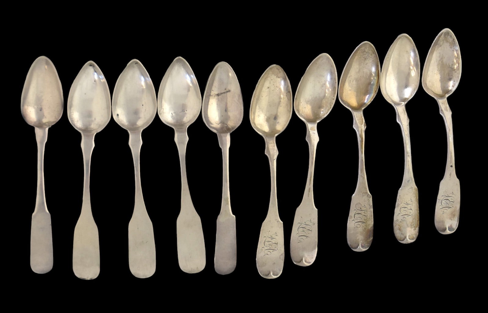 Ten Coin Silver Tea Spoons: All fiddlebacks, including five by Philadelphia maker R. & W. Wilson, engraved LEC, 5 1/2" long; plus three marked Samuel Warrington, Philadelphia, 5 1/2" long; and two marked E. Highes, 5 1/2" long. 