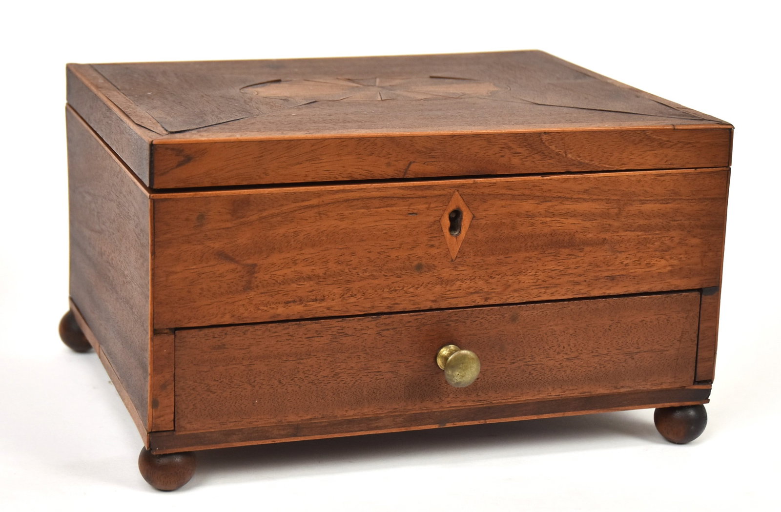 Inlaid Early Sewing Box: Mahogany with oval fan inlay on hinged locking lid with diamond escutcheon, over single drawer with brass knob, ball feet, opens to divided interior and original red paper liner on lid, 9 x 7 1/4 x5 3