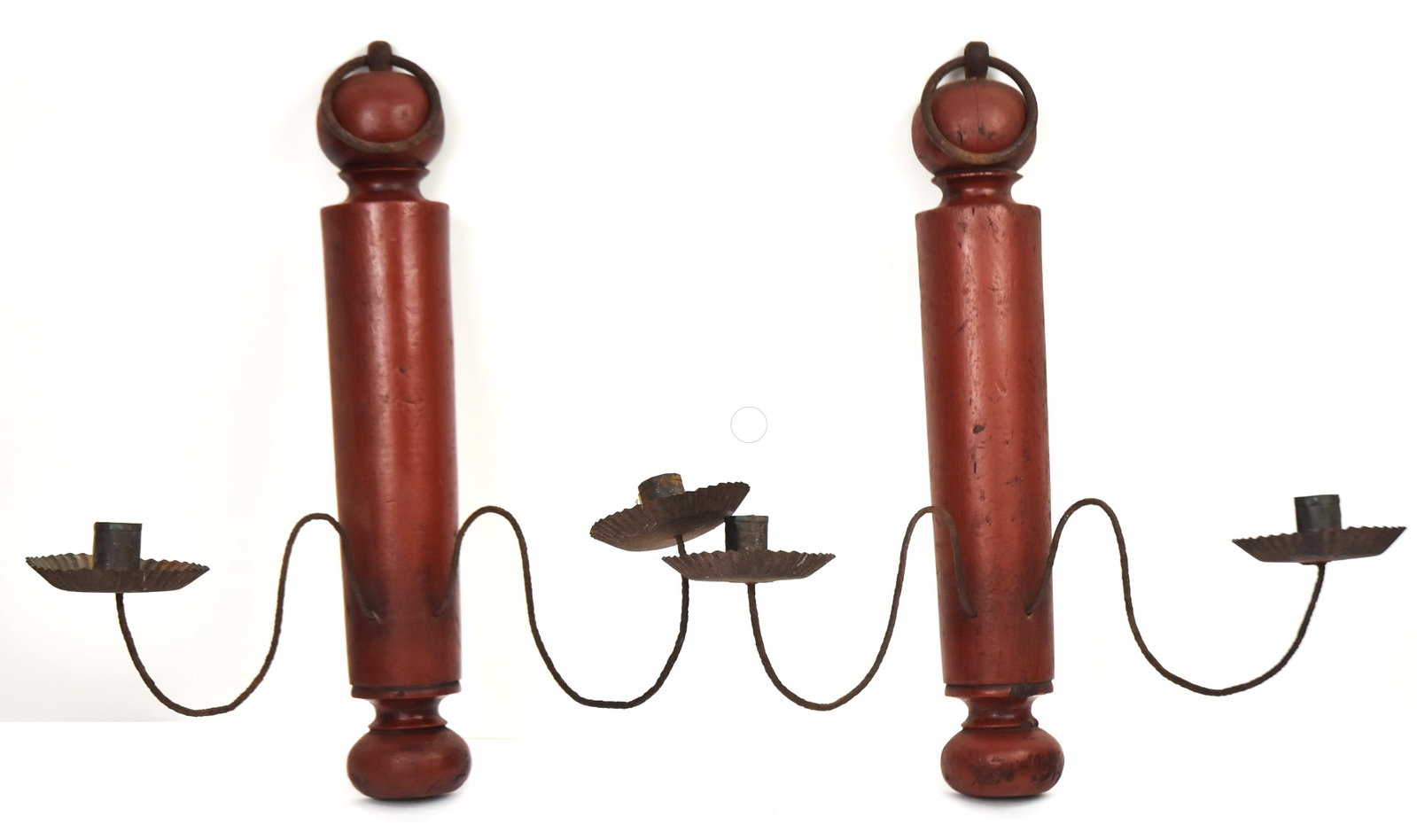Pair Turned & Painted Wall Candle Sconces: Red painted wood with tin two arm candle sconces, iron ring handle for handing, 13 1/2 x10 x 18" high. Condition VG+.