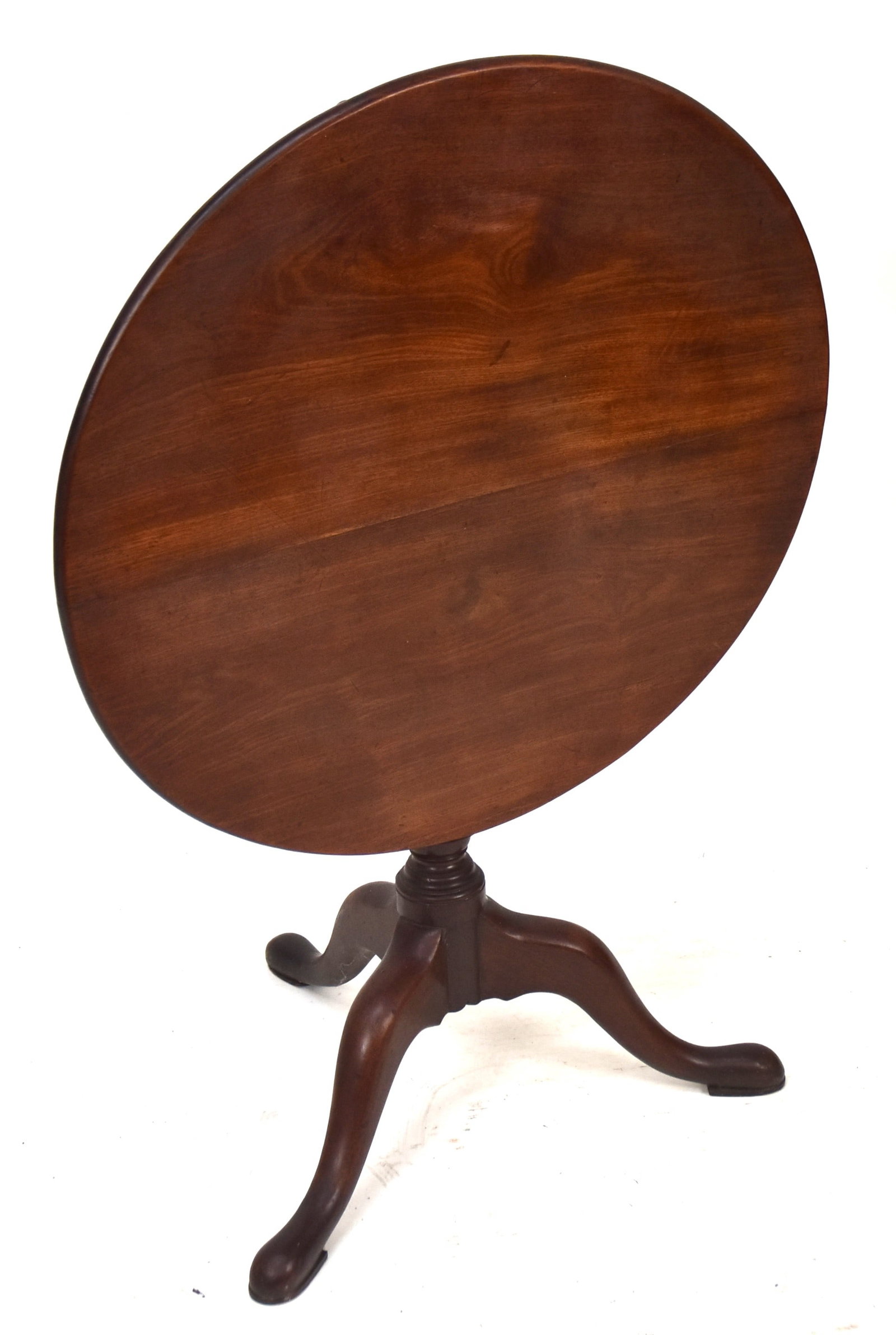 Queen Anne Tea Table: Mahogany with round tilt top, on baluster turned column and three cabriol legs with slipper feet, original brass keeper, 29 1/4 x 29 3/4" round x 27" high. Condition VG+.