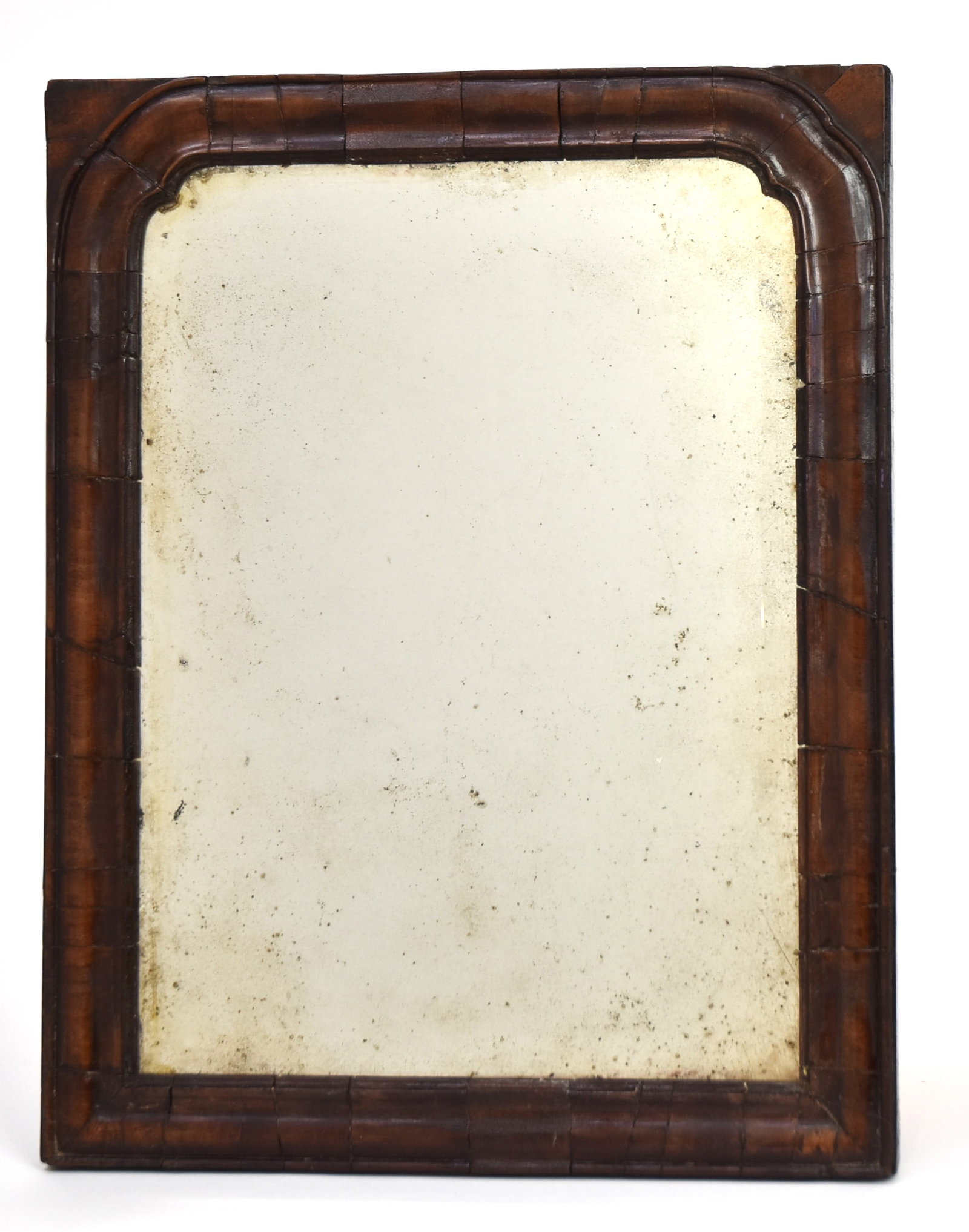 Queen Anne Carved Mirror: Mahogany with arched carved surround, old mirror glass, white pine secondary wood, nice old patina, 10 1/2x 13 3/16" high. Condition typical shrinkage lines and one small repair.